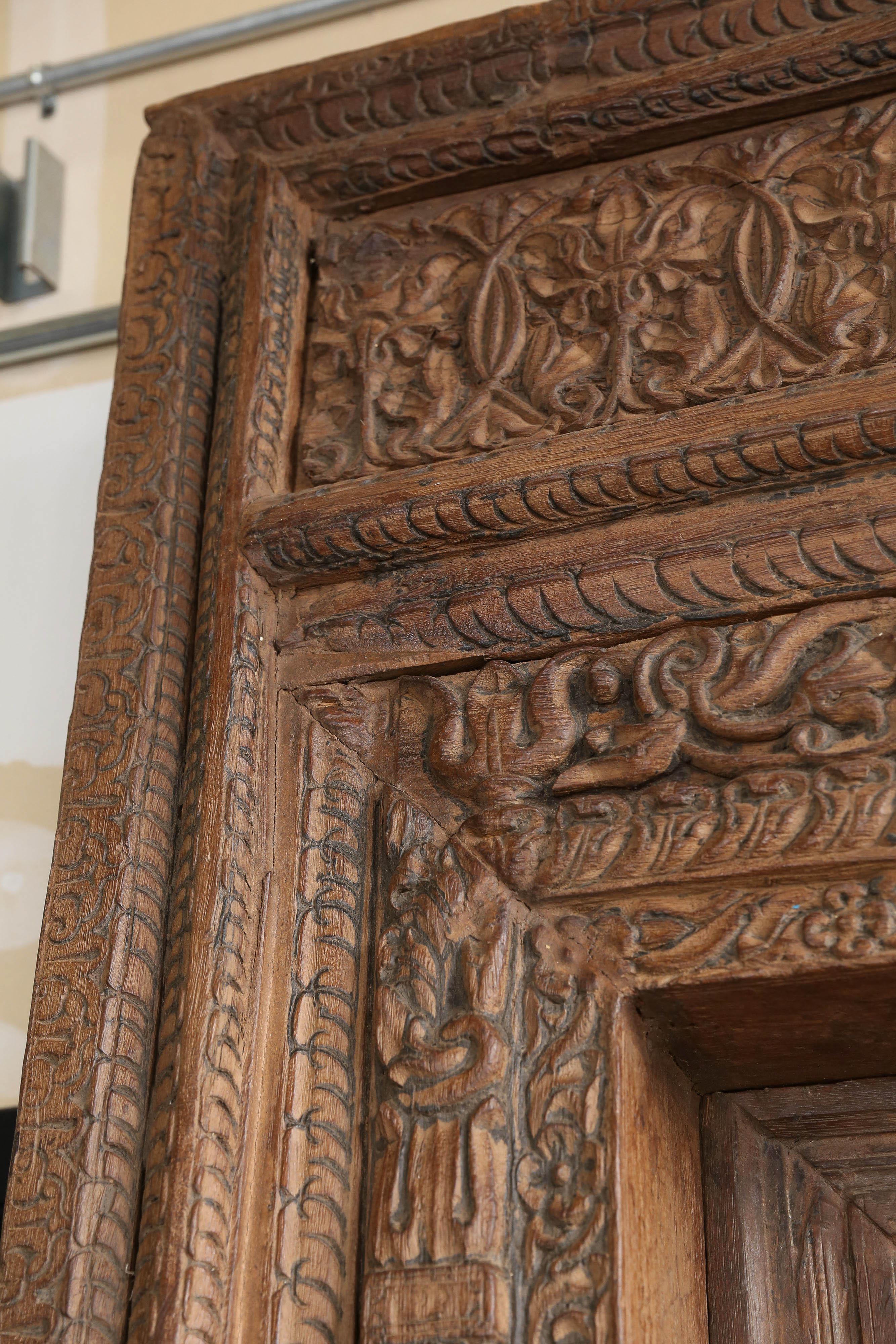200 Years Old Highly Carved Metal Studded Grand Entry Door from a Mansion In Good Condition In Houston, TX