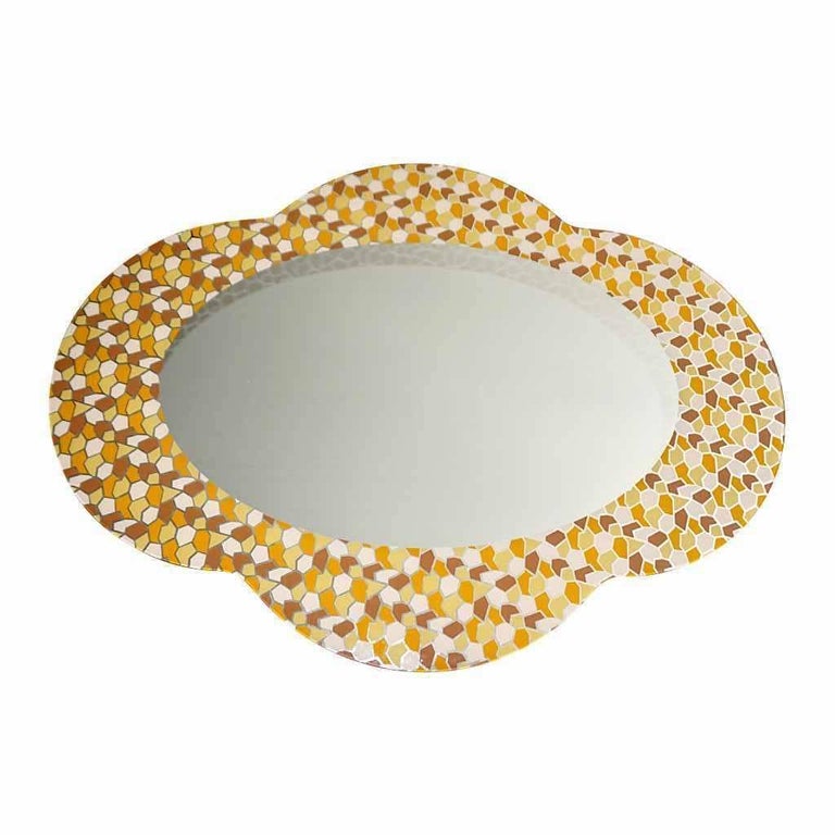 Shapes, decorations, colors: 3 omnipresent statements in Alessandro
Mendini’s work. This is a fun cloud shaped modern design mirror for Glas
Italia with a transfer see-through polychrome postmodern decor in brown,
orange, yellow and ivory colors