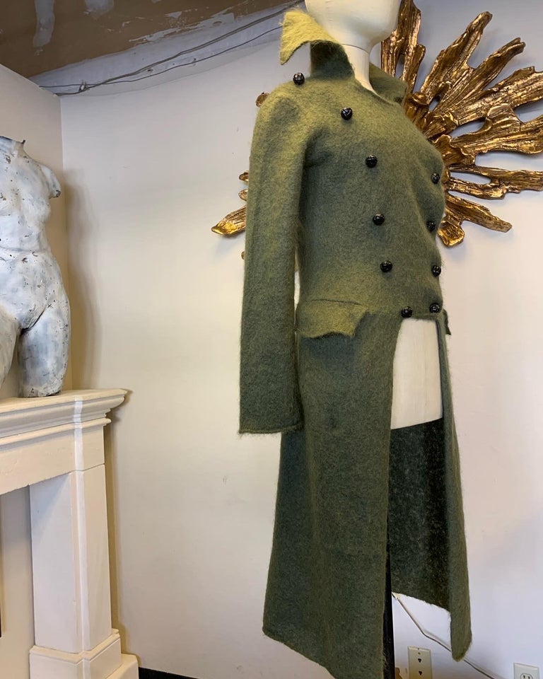 2000 Alexander McQueen Moss Green Kid Mohair Knit Cut-Away Military Style Sweater Coat w Tails: Double-breasted with tall split lapels, stand up collar and vented center back. Leather braided buttons and side hip flap front pockets. Marked Size L.