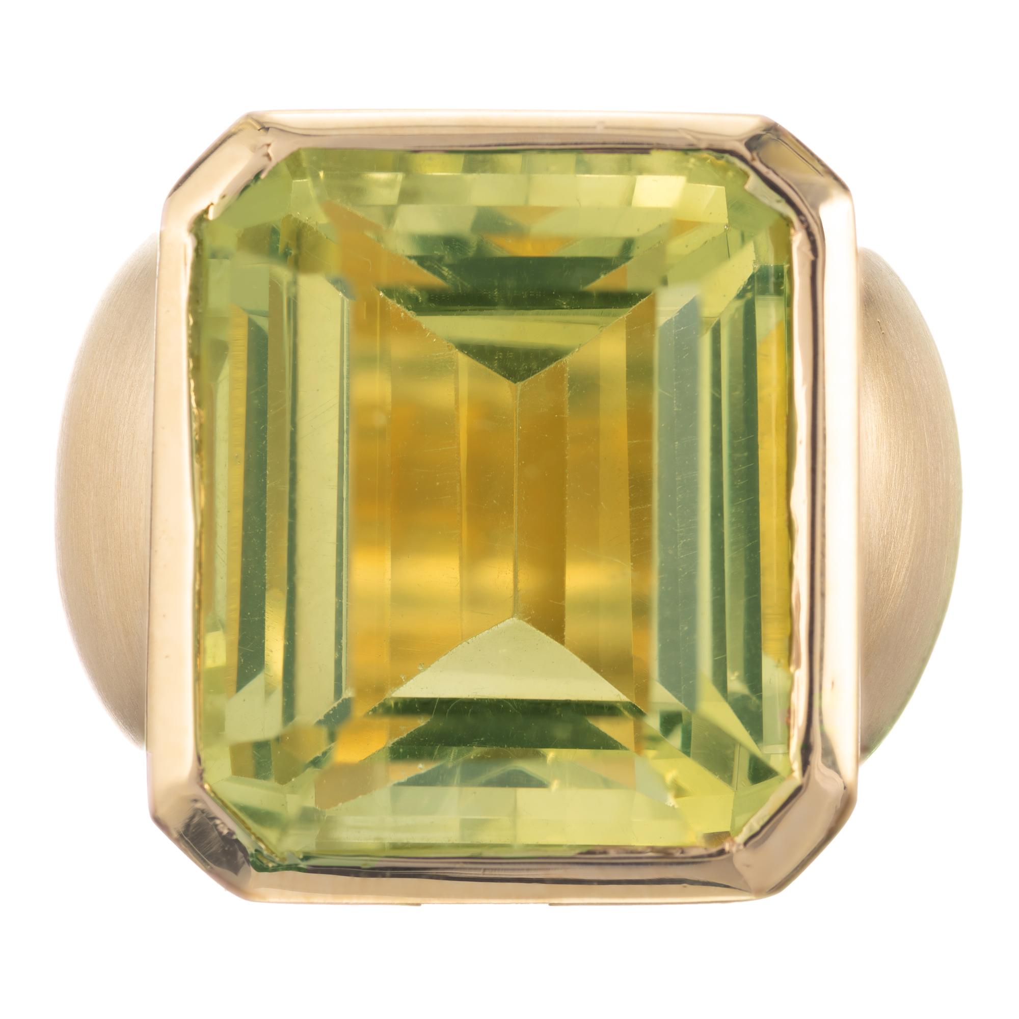 Heavy solid 18k yellow gold ring with a bright green yellow Prasiolite Quartz in a wide bezel set brushed finish ring with a row of bead set diamonds on the side. 

One 19.5 x 16 x 11mm Prasiolite light green Quartz, approx. total weight 20.00cts
40