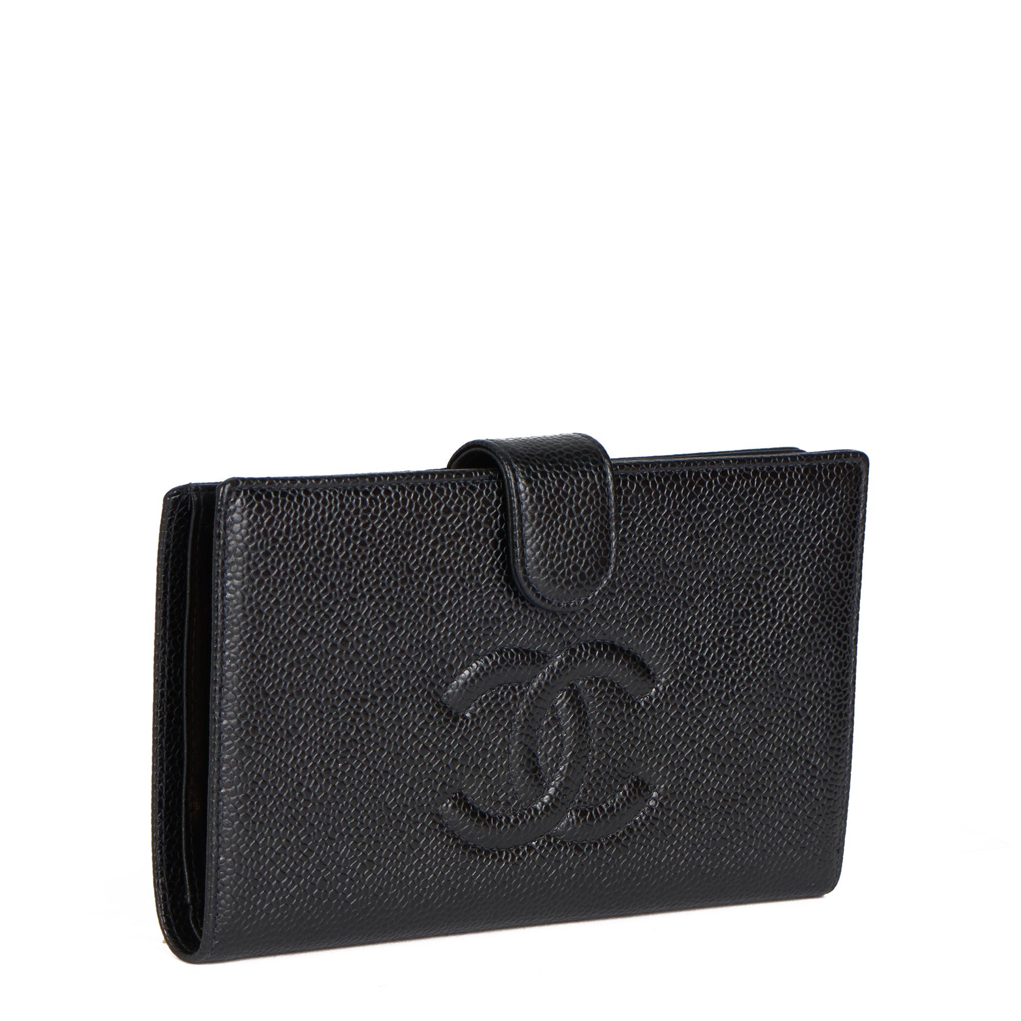 CHANEL
Black Caviar Leather Vintage Timeless Long Wallet

Xupes Reference: HB4168
Serial Number: 6324526
Age (Circa): 2000
Authenticity Details: Serial Sticker (Made in France)
Gender: Ladies
Type: Wallet

Colour: Black
Hardware: Gold 
Material(s):