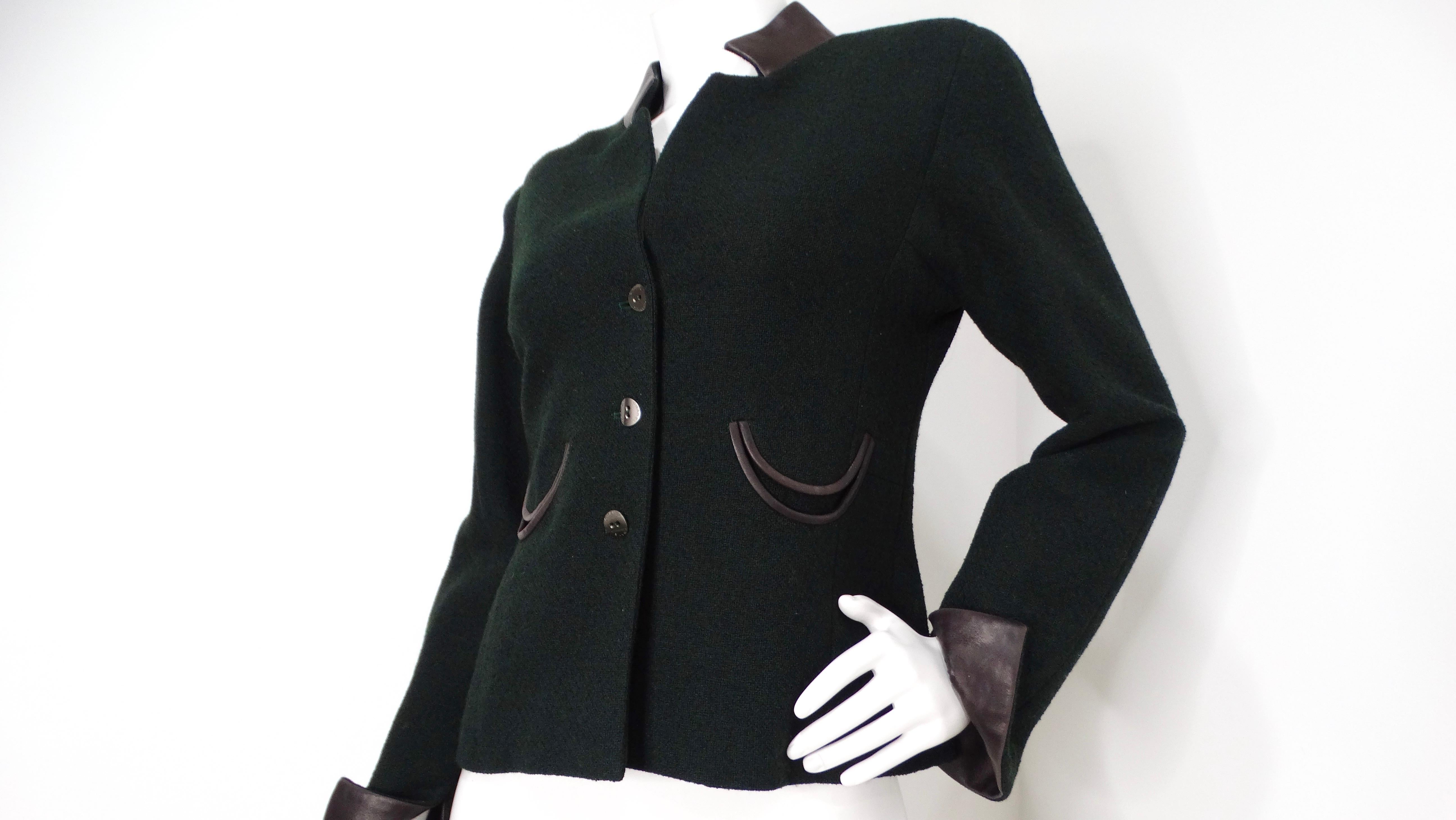 The 2000 Chanel Dark Green Wool Blend Jacket is a sophisticated statement piece that effortlessly combines luxury and style. Crafted from a high-quality wool blend, this jacket features rich dark green hues complemented by striking black leather