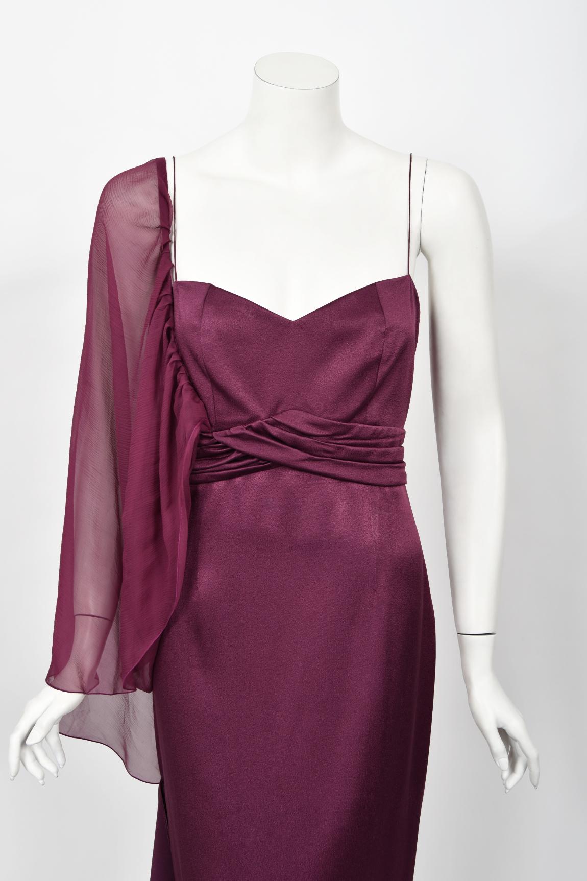 An incredibly chic and ultra rare Christian Dior plum purple silk asymmetric draped gown from John Galliano's highly acclaimed 2000 spring-summer collection. John Galliano is widely considered one of the most innovative and influential fashion