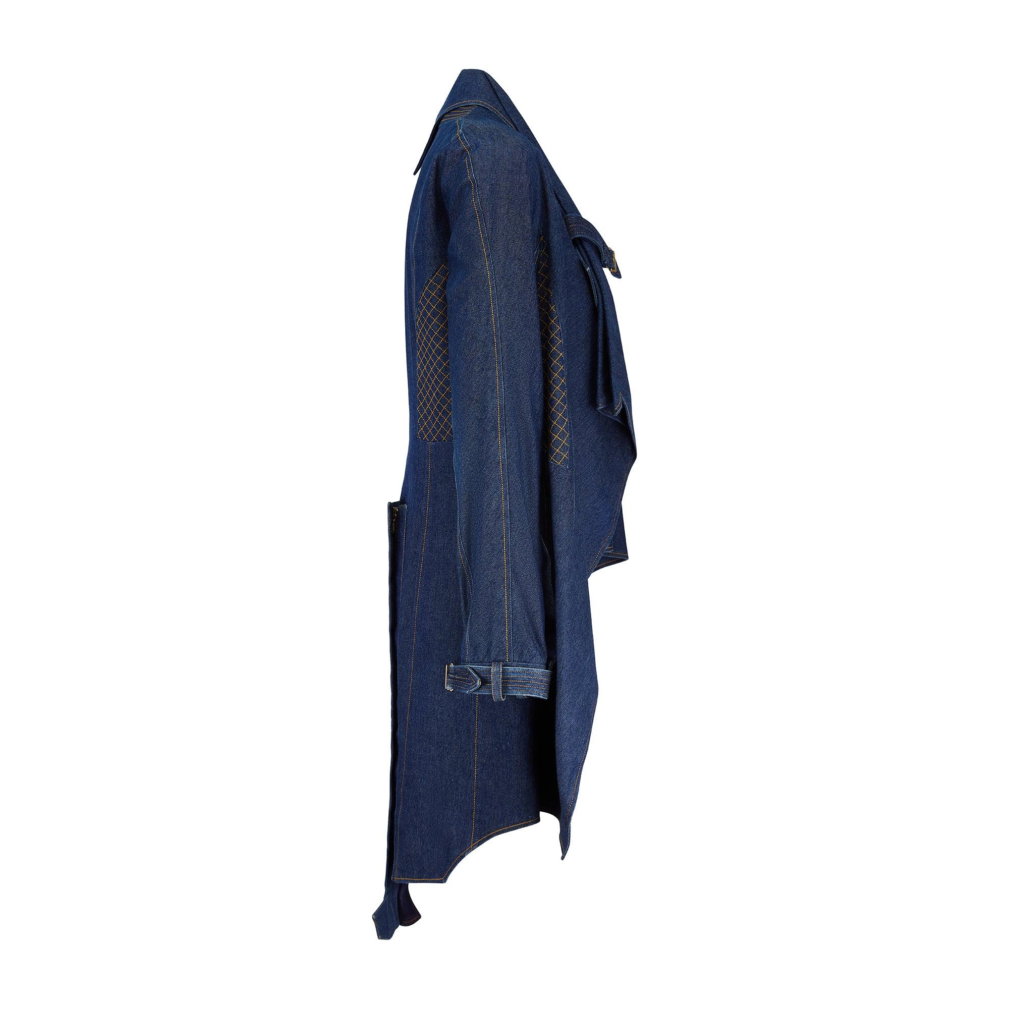 This incredibly detailed Christian Dior denim coat was created as part of the Spring 2000 collection. Designed by John Galliano during his lauded tenure as Creative Director, Vogue wrote “John Galliano’s romp started with a series of wildly sexy
