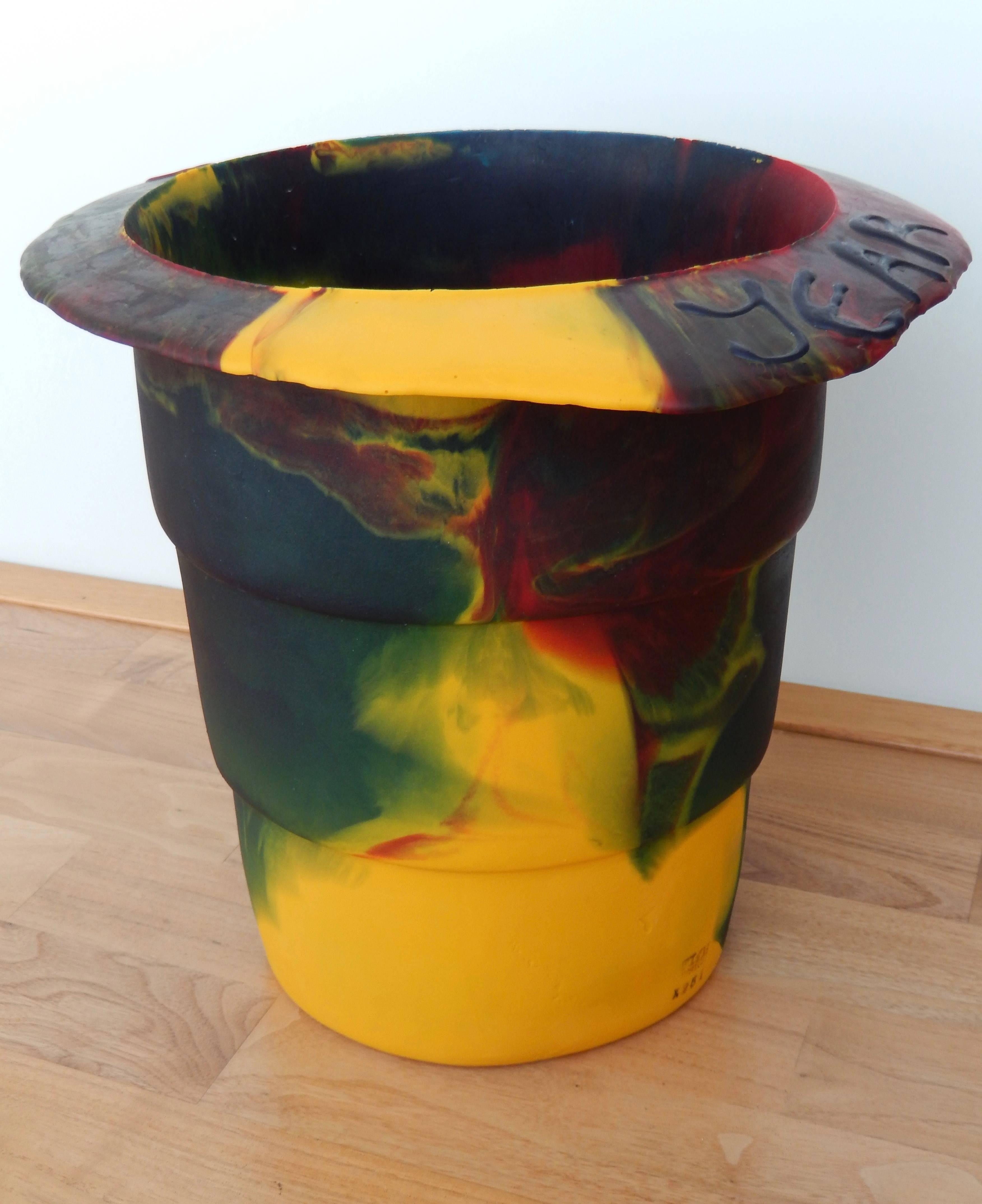 A multicolored resin bucket commemorating the Millennium by the avant-garde Italian architect Gaetano Pesce (b. 1939). Pesce has cleverly incorporated 