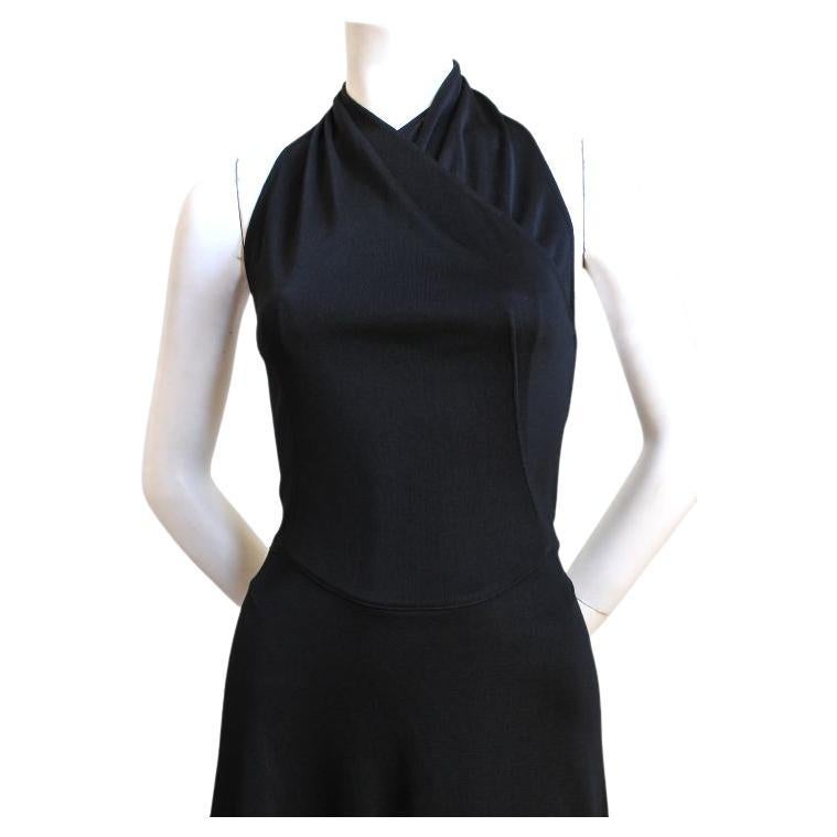 Very rare, jet-black dress from Alaia dating to 2001 as seen in numerous places including: Karolina Kurkova as published in Elle US September 2000, Stephanie Seymour in New York, 2001 as well as an editorial and also on the Alaia couture runway.