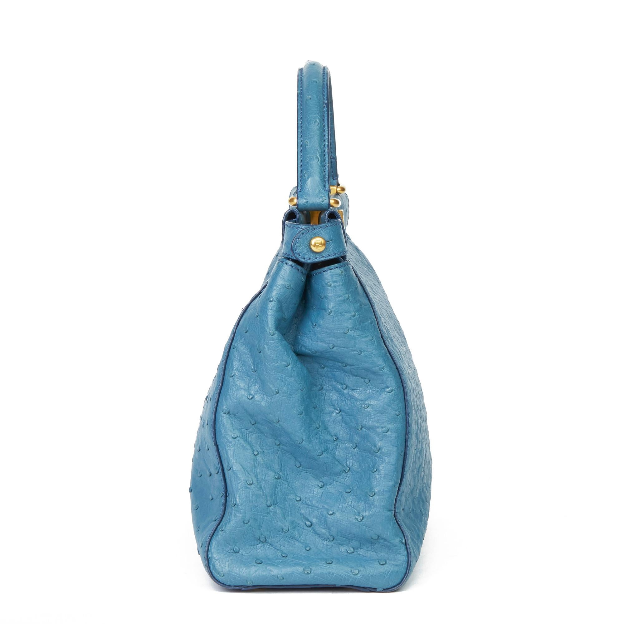 FENDI
Blue Ostrich Leather Small Peekaboo

Xupes Reference: HB439
Serial Number: 8BN226-A9P129-010
Age (Circa): 2000
Accompanied By: Shoulder Strap, Care Booklet
Authenticity Details: Serial Tags (Made in Italy)
Gender: Ladies
Type: Top Handle,