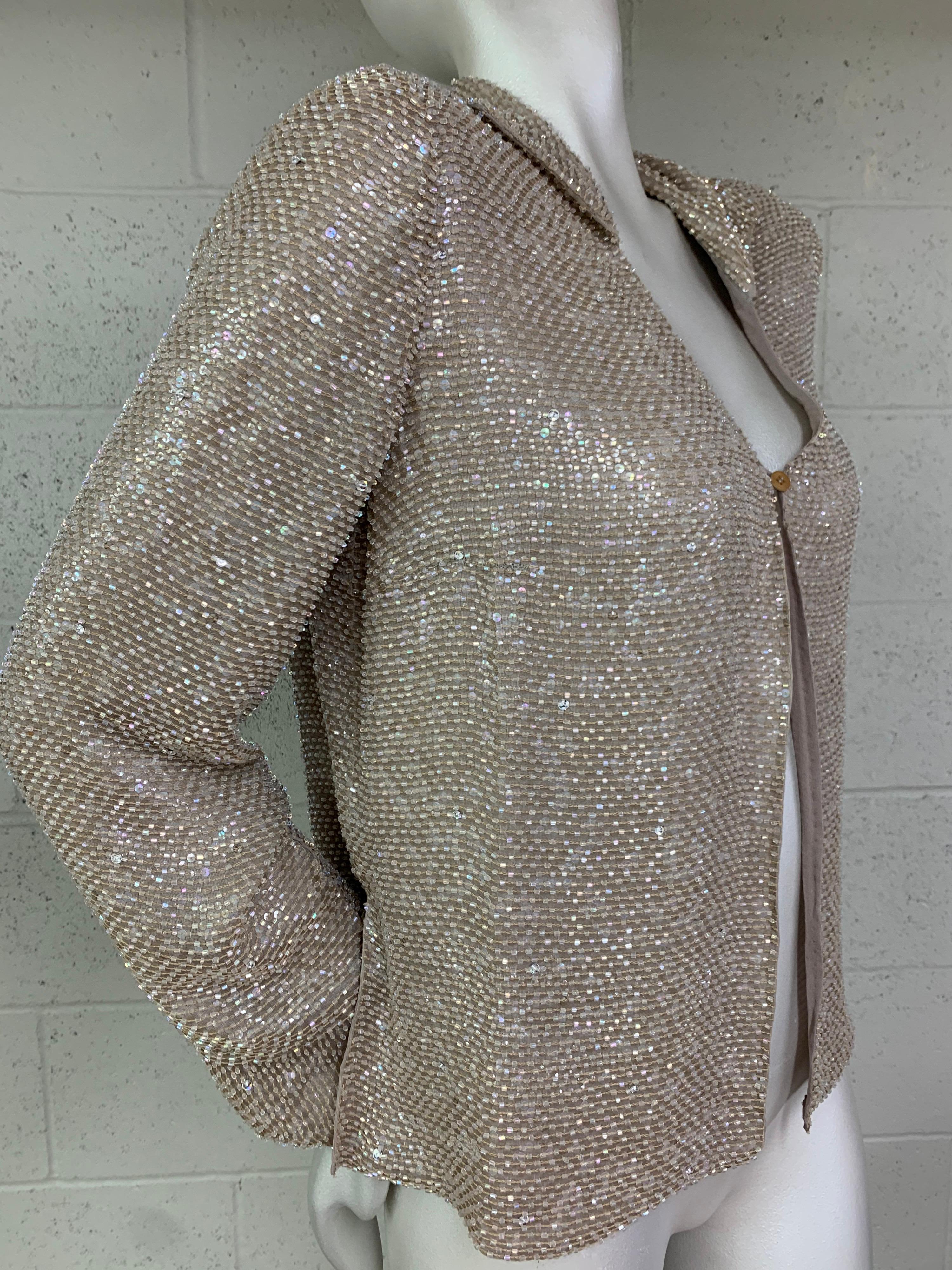A stunning 2000s Giorgio Armani dusty rose beaded and sequined silk jacket with single closure at front. Fully lined in silk. Vented cuffs. Size EU 46. New, never worn.
