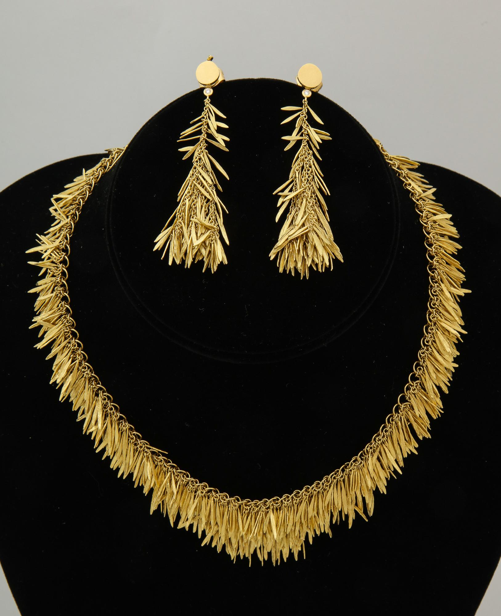 One Ladies 18kt Individually Hand Carved Flexible And Articulated Suite Composed Of One Pair Of Handmade Moveable Dangle Earrings For Pierced Ears Only.Measurement Of Earrings= 2.5 inches Long And .50 Inches At Widest Point. En Suite Is A Necklace