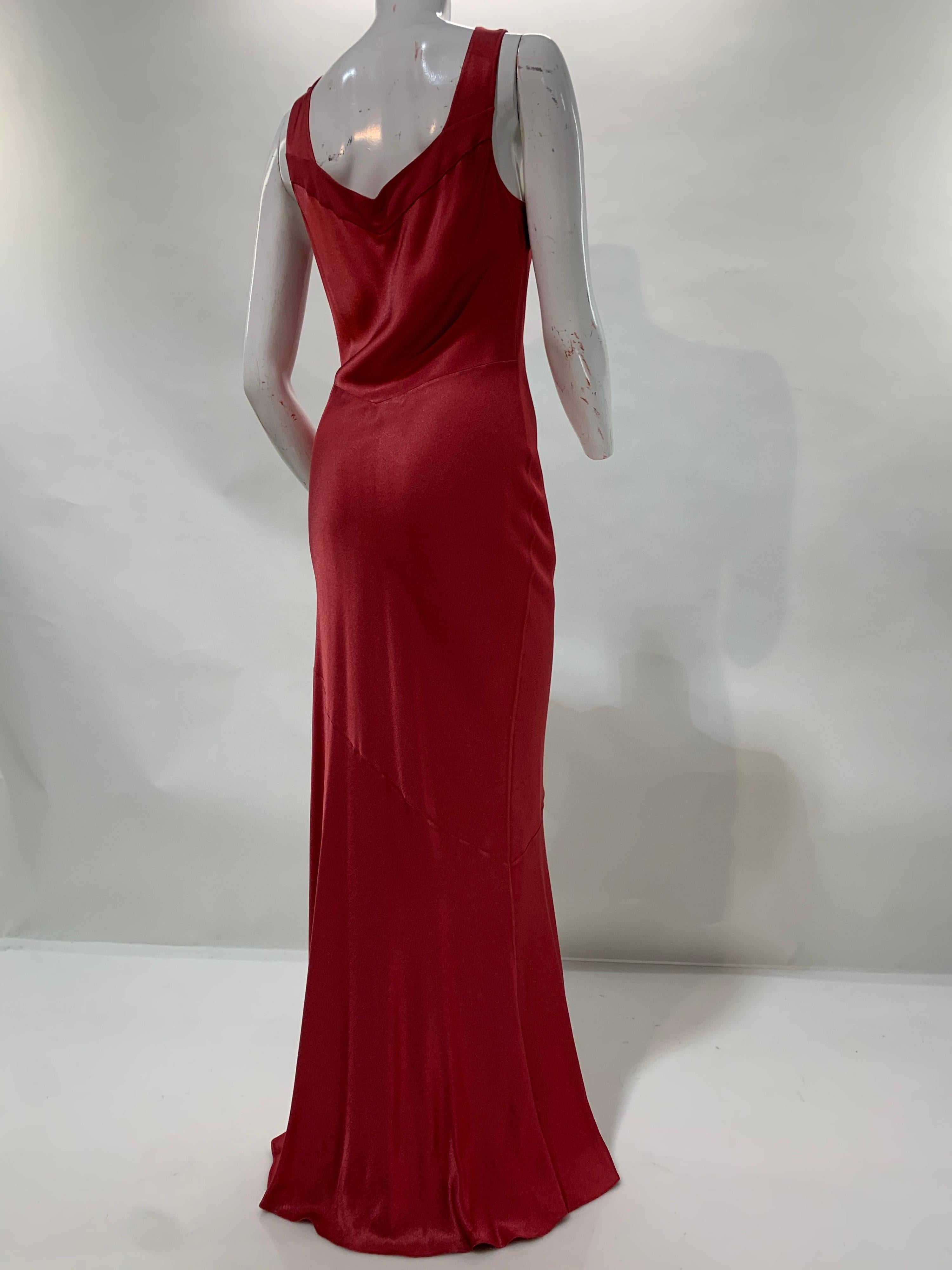 A 21st century John Galliano raspberry red body-conscious, bias-cut, crepe-backed, satin gown with flared train and side slit. So simple. So sexy. Size 8.