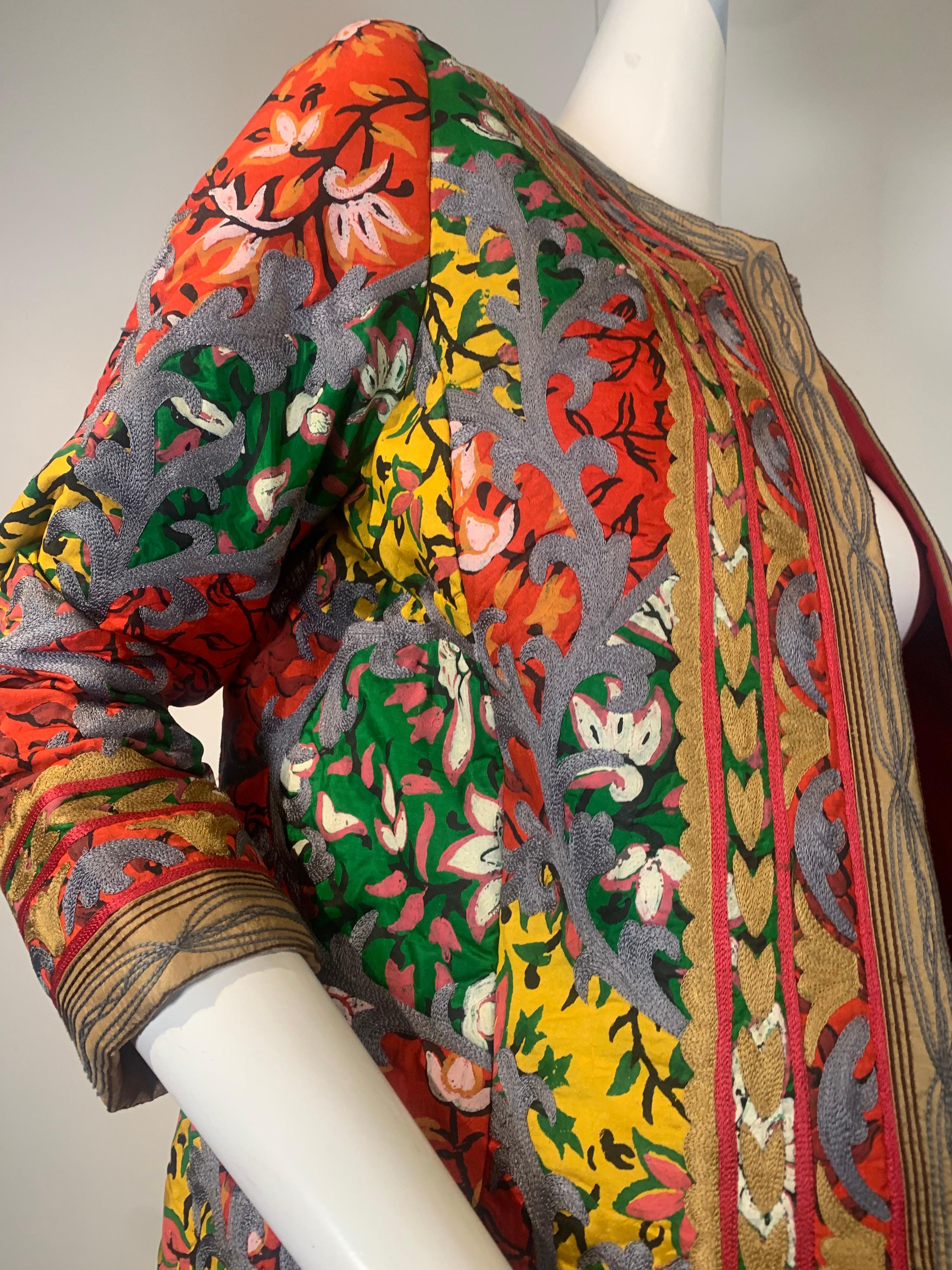2000s Oscar de la Renta Turkish-styled coat: Silk embroidery over a silk stylized floral with gold embroidered trim. Fully lined. Size 8. No closures or collar. Worn open. 