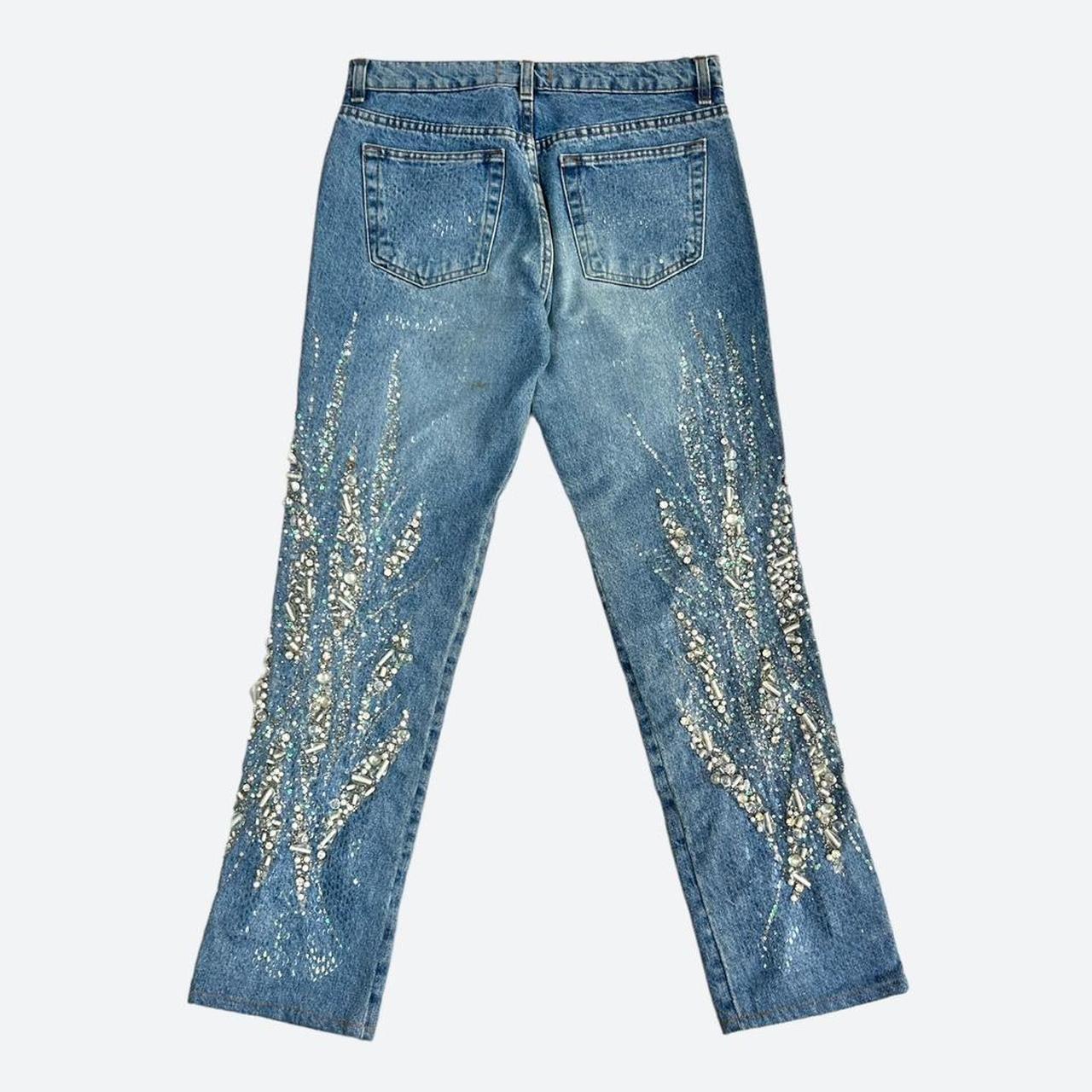 Very rare Roberto Cavalli blue jeans from the brilliant SS 2000 Diamond Collection, these are embellished from the thighs down in hand-embroidered silver beads, rhinestones and sequins, creating a magical, glistening abstract design around the legs