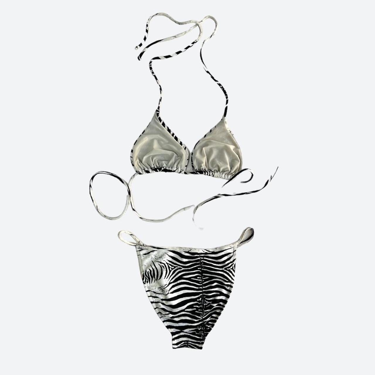This stunning bikini is from the iconic Roberto Cavalli SS 2000 Diamond Collection and appeared both on the runway and in the season's campaign, a collection that brought us some of the most defining trends from the beginning of the millennium. 

In