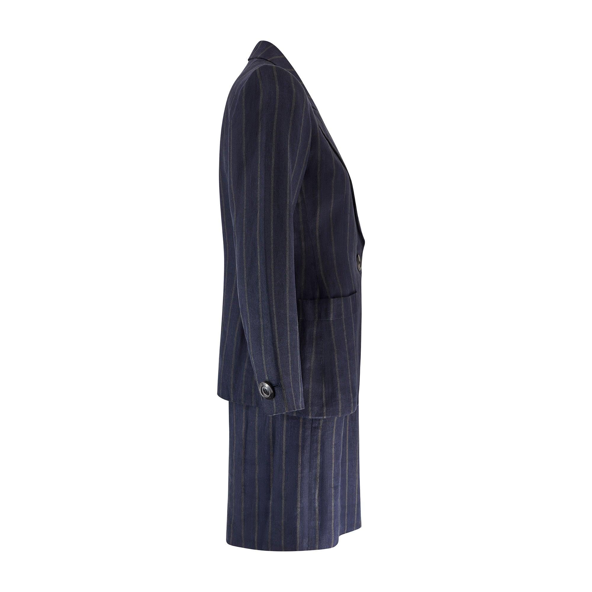 This Yves Saint Laurent navy pin-stripe skirt suit walked the runway for the Fall 2000 collection and was designed by the great and late Alber Elbaz. He briefly worked for the House from 1998 to 2000 having replaced the eponymous founder upon his