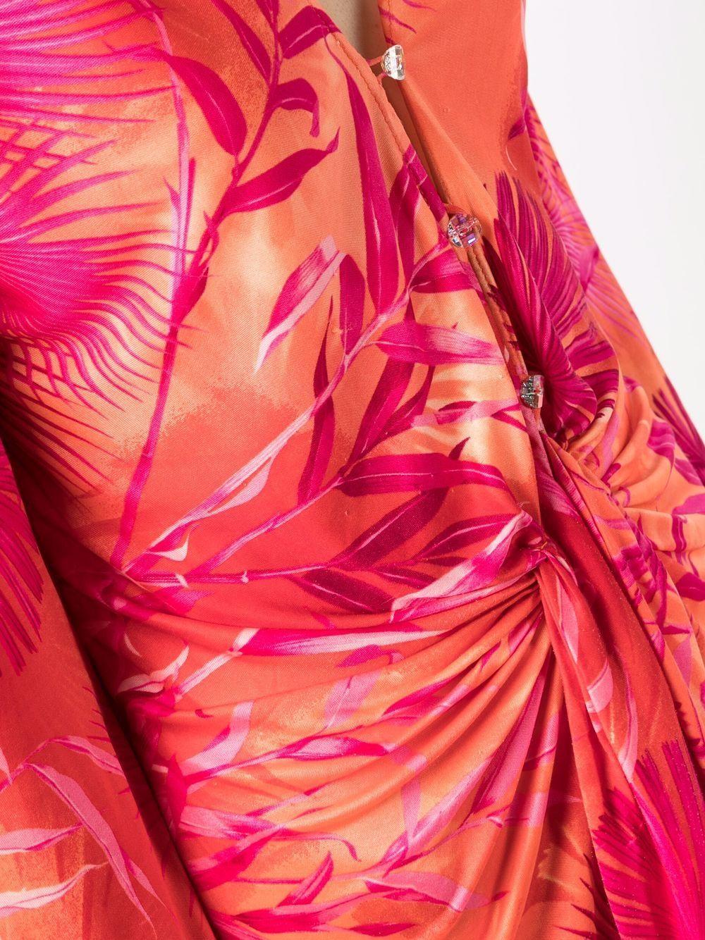 2000 Iconic Gianni Versace pink Jungle silk dress featuring a scoop neckline, can be worn unbuttoned for more of plunging neckline, crystal front button closure with sash ties at waist.
It was the dress and print made famous by Jennifer Lopez and