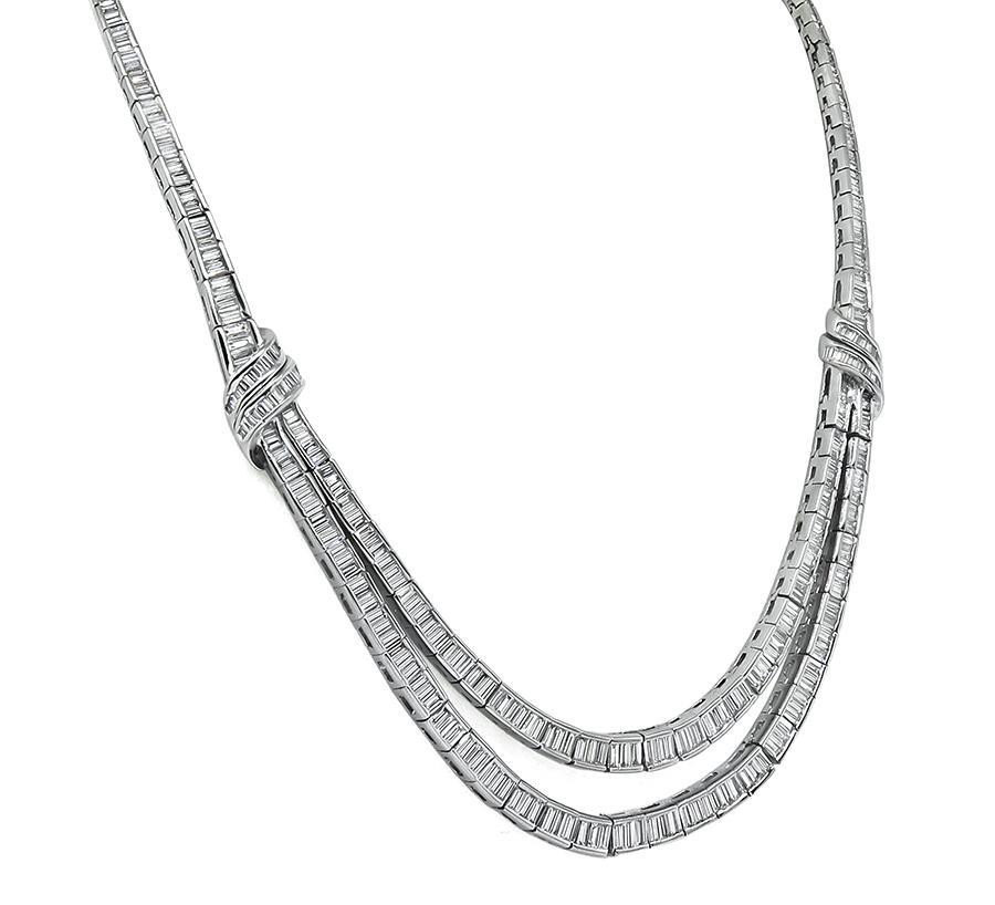 This is a gorgeous platinum necklace. The necklace is set with sparkling baguette cut diamonds that weigh approximately 20.00ct. The color of these diamonds is G with VS clarity. The necklace measures 16 3/4 inches in length and weighs 83 grams. The