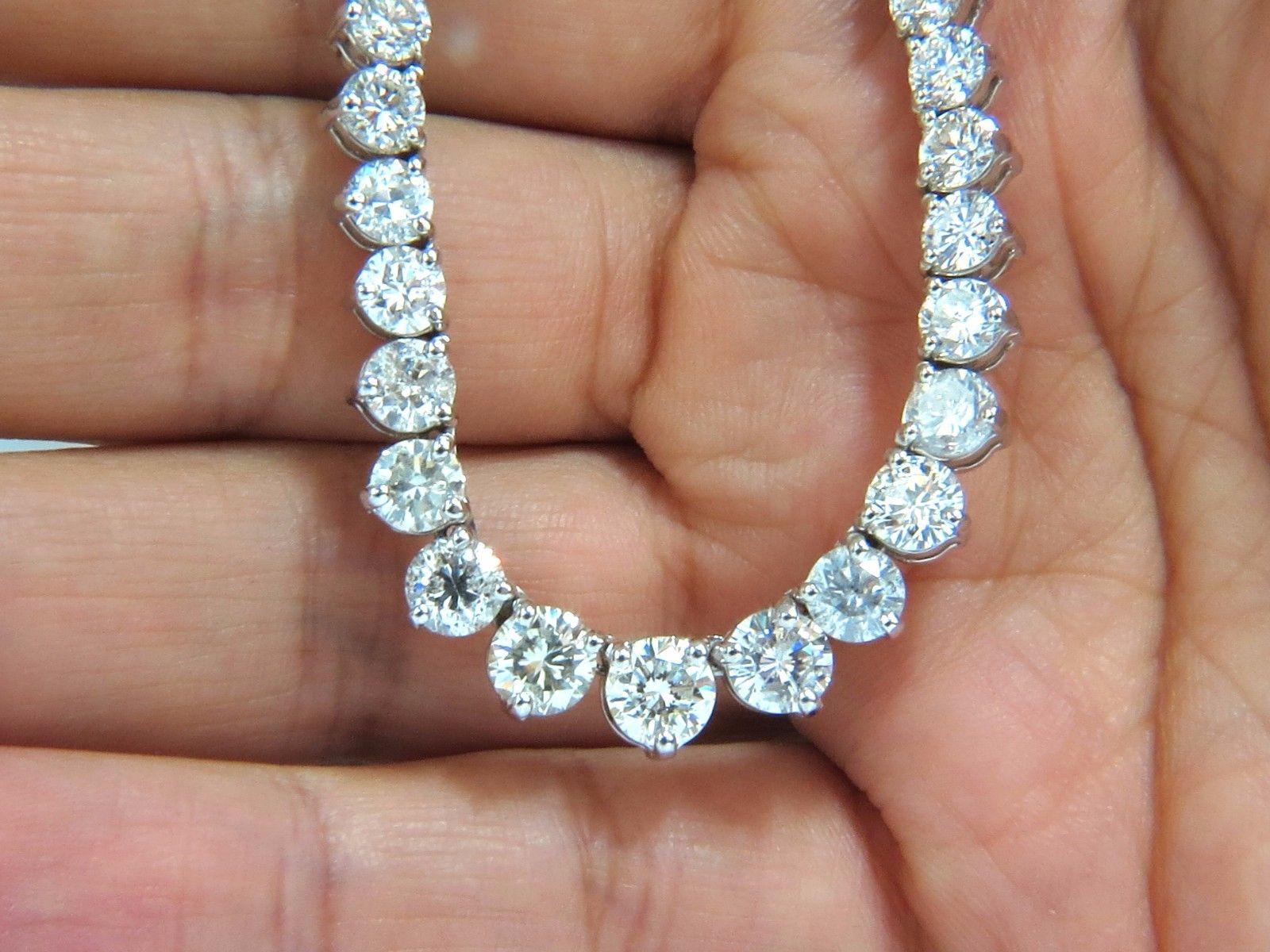 Classic Diamond Riviera / Tennis Necklace

20.00ct. Natural 109 diamonds.

.95ct center, surrounded by .87ct, .75ct & .50ct. etc.

Rounds & Full cuts

H-I colors Si-2 Si-3 clarity. 

14kt white gold 

33.3 grams.

17 Inches - wearable