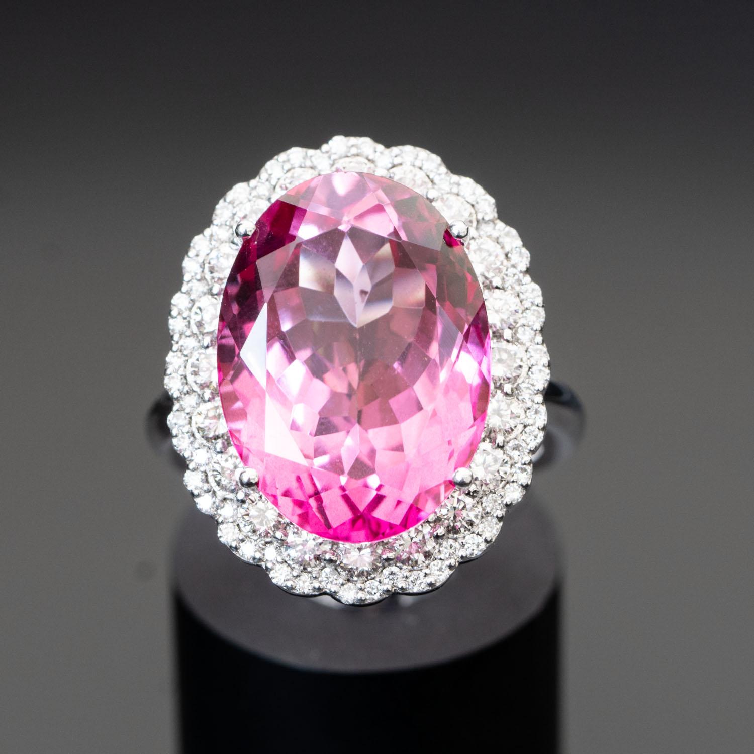 This gorgeous pink topaz ring will impress everyone around you. It features a large oval 20.00 carat gemstone, adorned with 1.20 carat natural diamonds.

Natural Topaz
Number of Stones:1
Shape & Cut:Oval
Carats Weight:20.79
Measurements: 18.02 X
