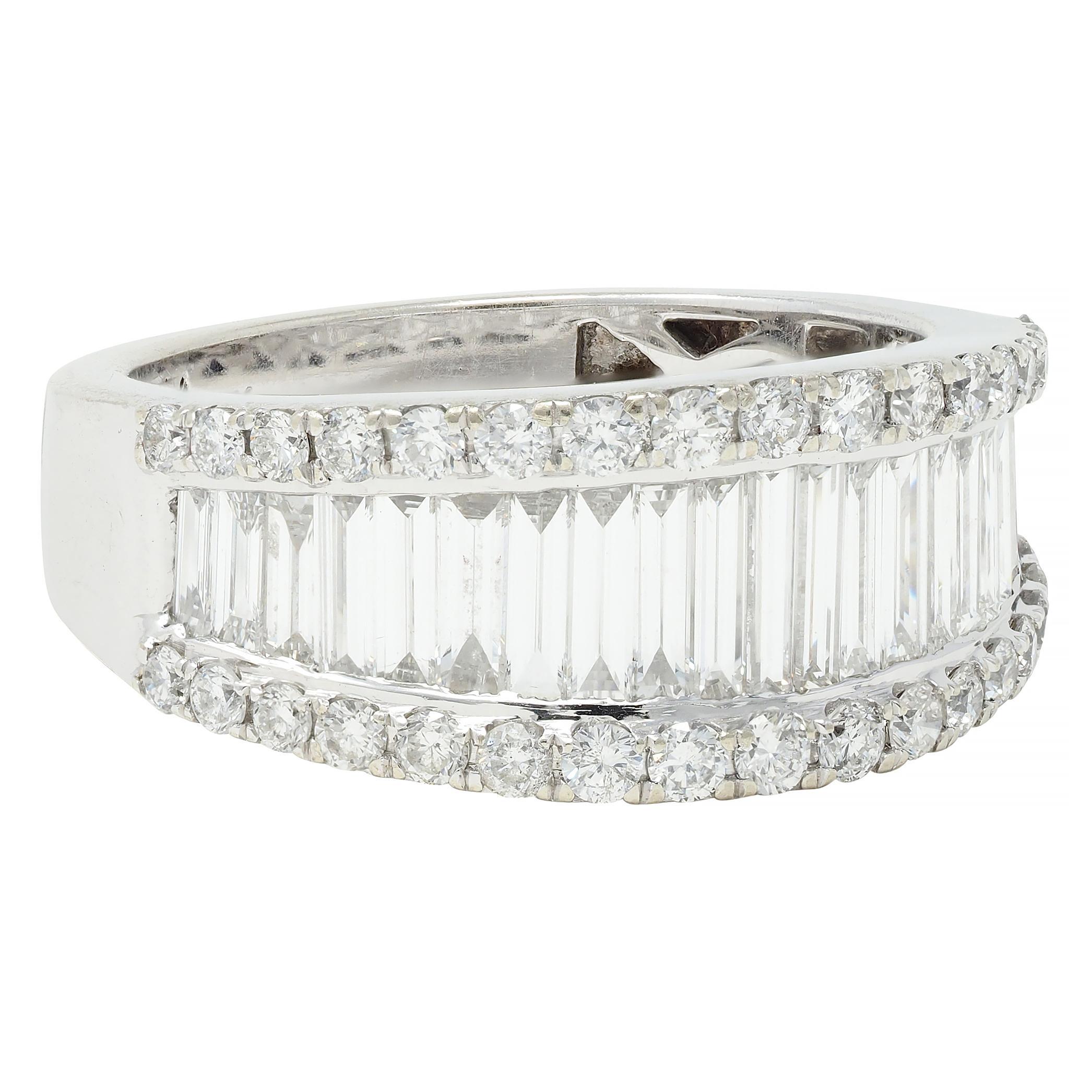 Featuring baguette cut diamonds set to front in a graduated channel 
Channel walls are prong set with round brilliant cut diamonds
Weighing approximately 1.59 carats total - G/H color with VS2 clarity
Inner-shank is pierced with a lattice