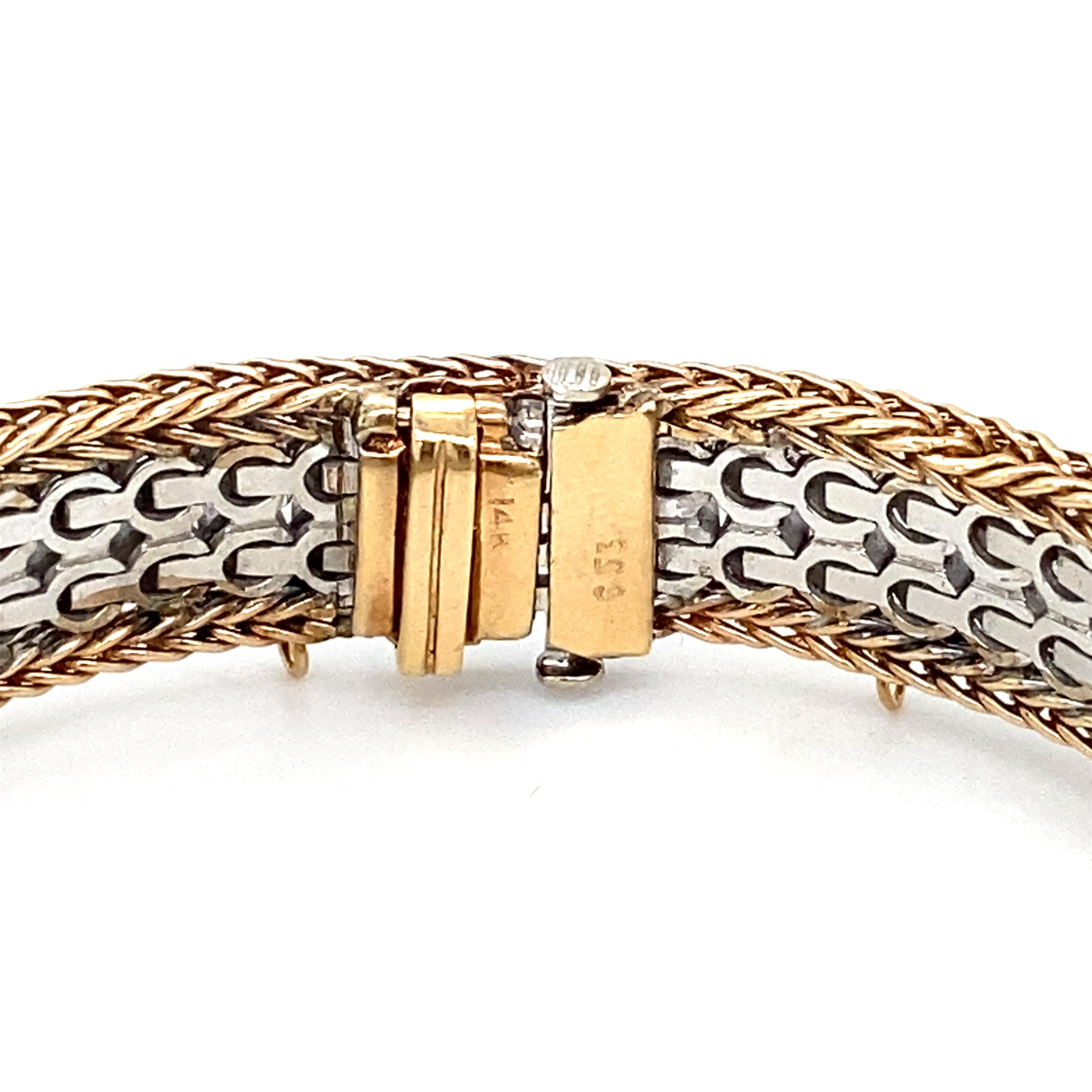 Item Details: This tennis bracelet features a braided basket weave border of 14k gold and a center double row of brilliant round diamonds.

Circa: 2000s
Metal Type: 14 Karat Gold
Weight: 34.5 grams 
Size: 6.75 inch length 

Diamond Details:

Carat: