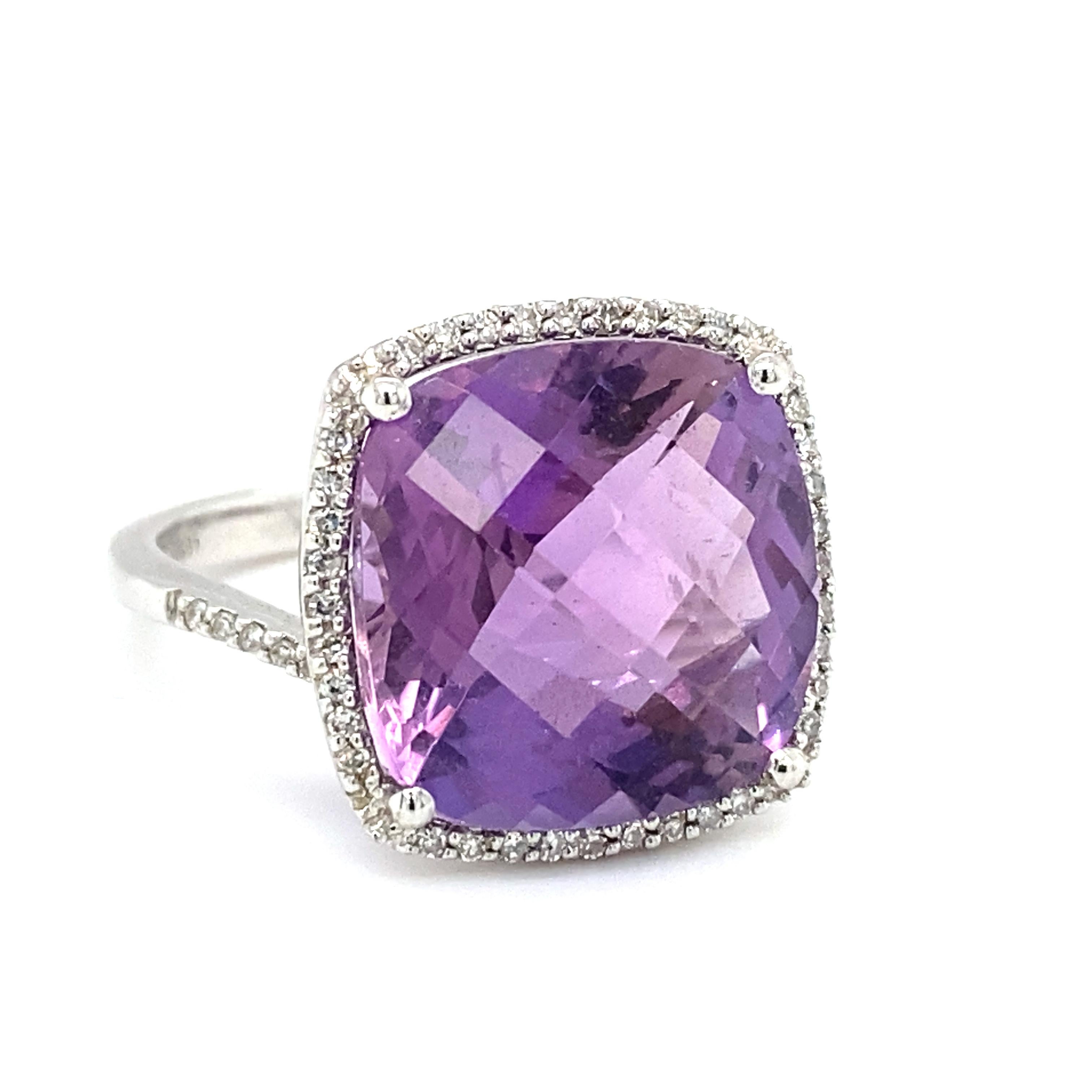 Item Details: This ring with an approximately 8.0 Carat checkerboard cut square amethyst has a halo of diamonds and is set in 14k white gold. It features a unique crisscross design on the shank, which adds to the elegance of the ring. when worn.