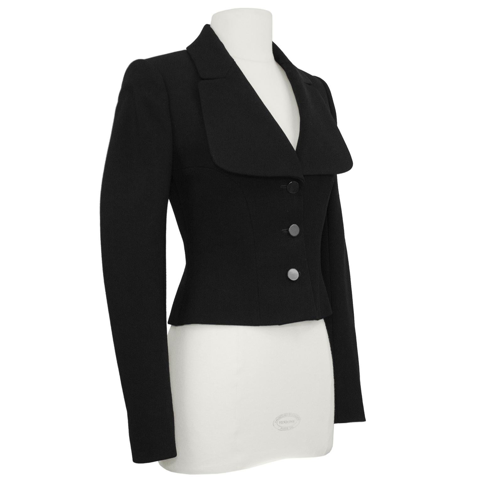 Azzedine Alaia blazer from the early 2000s. A very chic, cropped and fitted wool blazer. Long sleeves with an oversized and rounded collar that creates a deep v neckline. Three dark grey tortoise shell plastic buttons. Black poly lining. Azzedine
