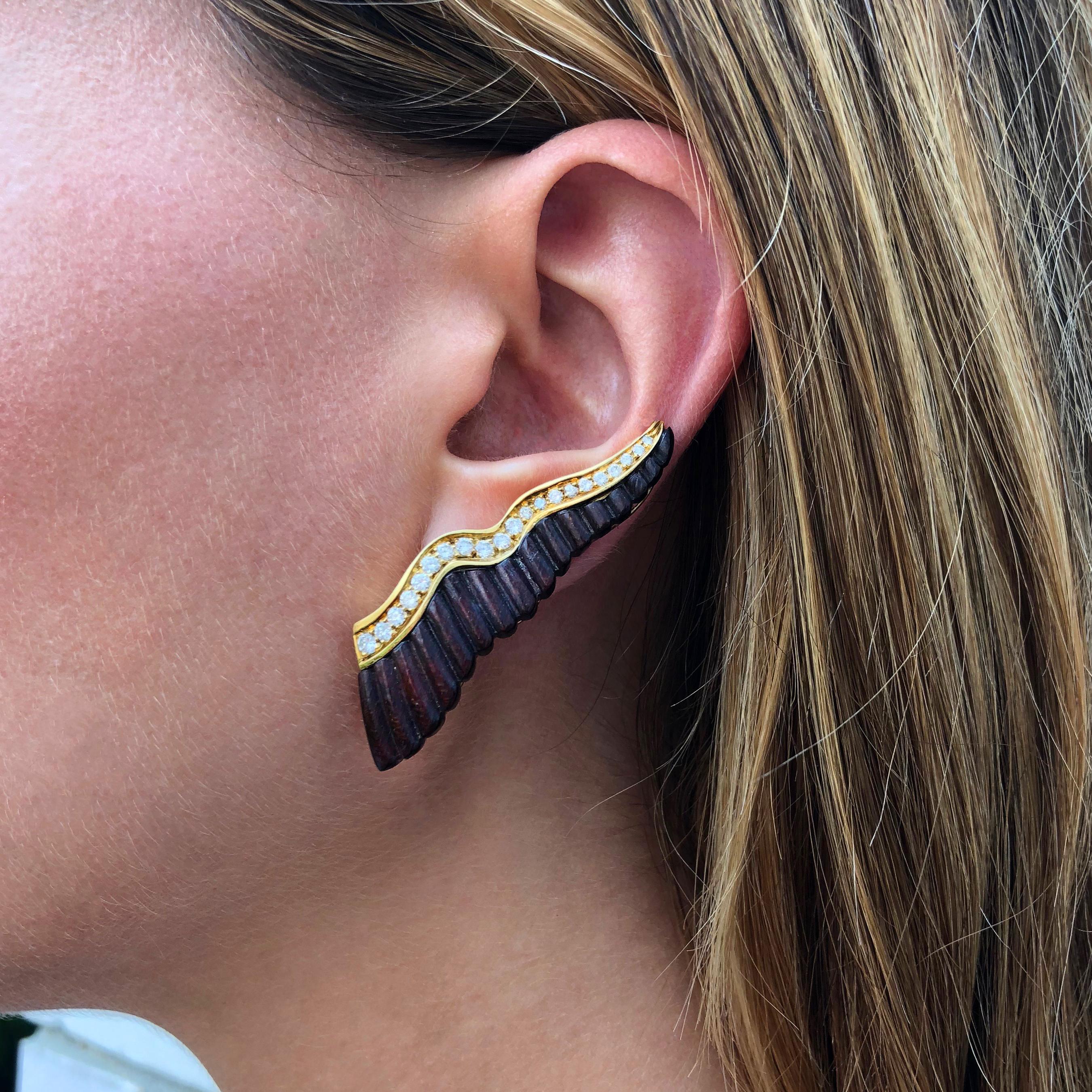 A chic, 2 inch long pair of carved wood, diamond, and 18 karat gold earclips, by award winning jeweler, Albert Lipten, c. 2000. The earrings are signed Albert Lipten, c, 18K, and are worn upwards on the earlobe.