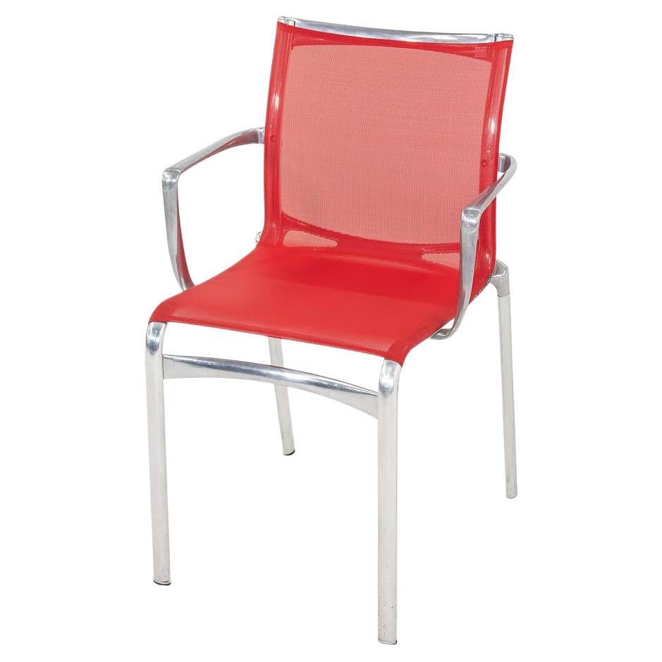 These are Bigframe 44 Stacking Chairs, originally designed by Alberto Meda in 1991. These particular examples were produced by Alias in Italy circa the 2000s. The chair's design features an aluminum frame with a red mesh lined seat and back. The