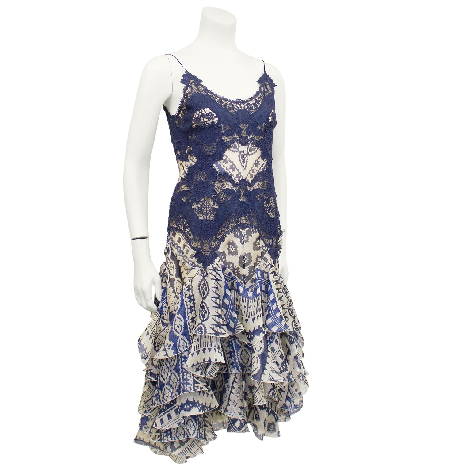 Alexander McQueen cocktail dress from the early 2000's. Blue lace bodice on top of printed chiffon. Drop waist cascades into flounces of layered chiffon. Zipper up centre back. Excellent vintage condition. Fits like a US size 4. Perfect for an early