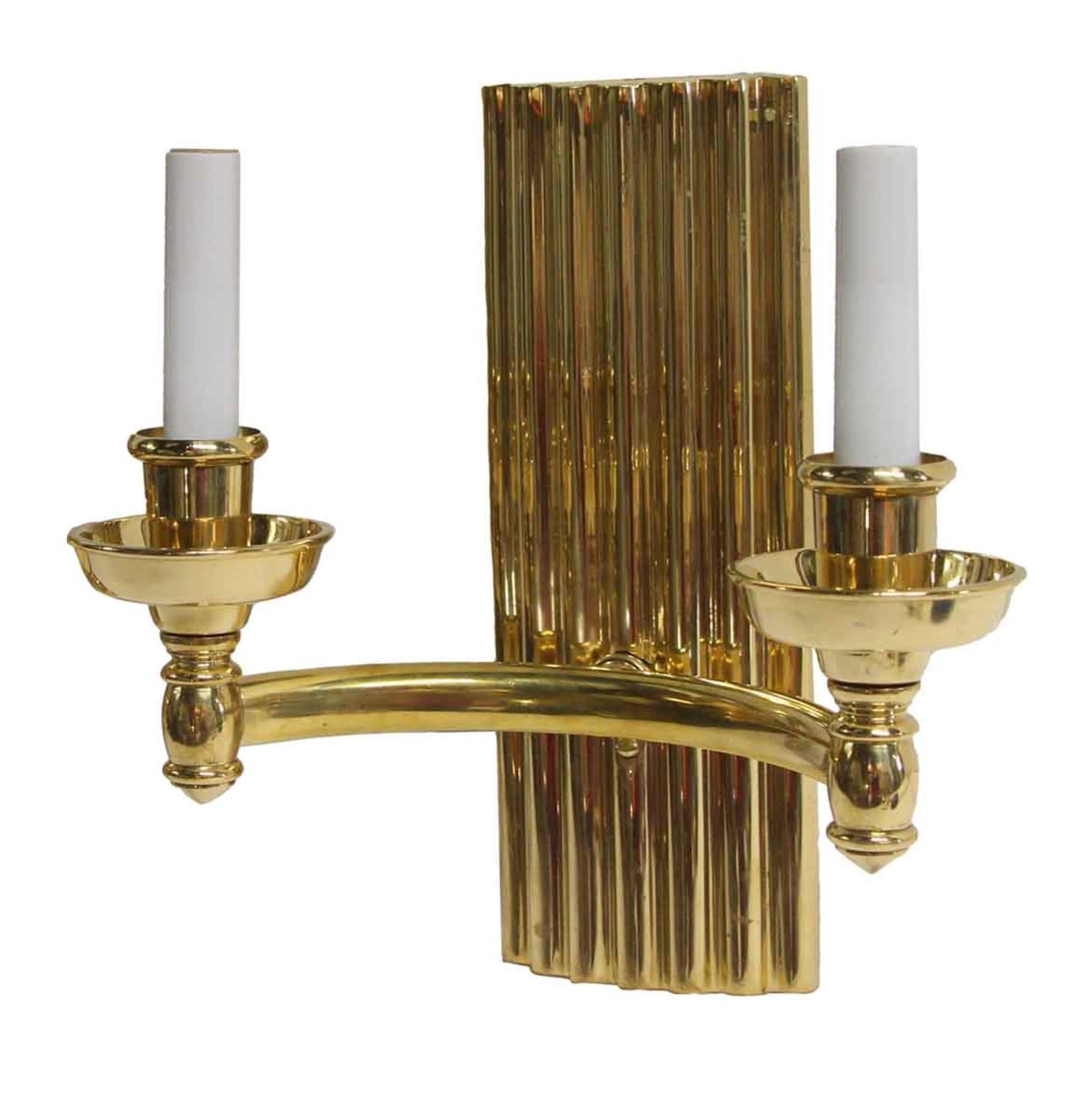 2000s double arm ribbed back and high polished finish Art Deco style heavy cast brass. Small quantity available at time of posting. Priced each. Please inquire. Please note, this item is located in our Scranton, PA location.