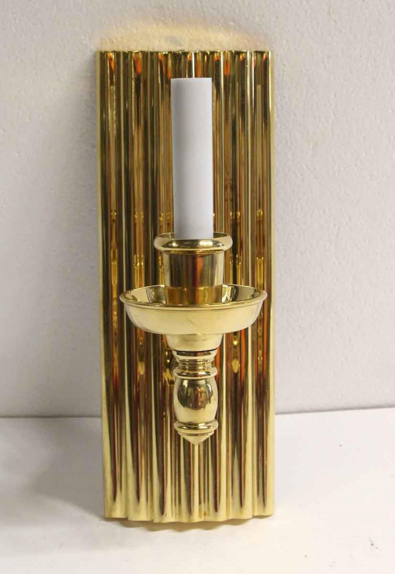 2000s single arm ribbed back and high polished finish Art Deco style heavy cast brass. Small quantity available at time of posting. Priced each. This can be seen at our 400 Gilligan St location in Scranton. PA.