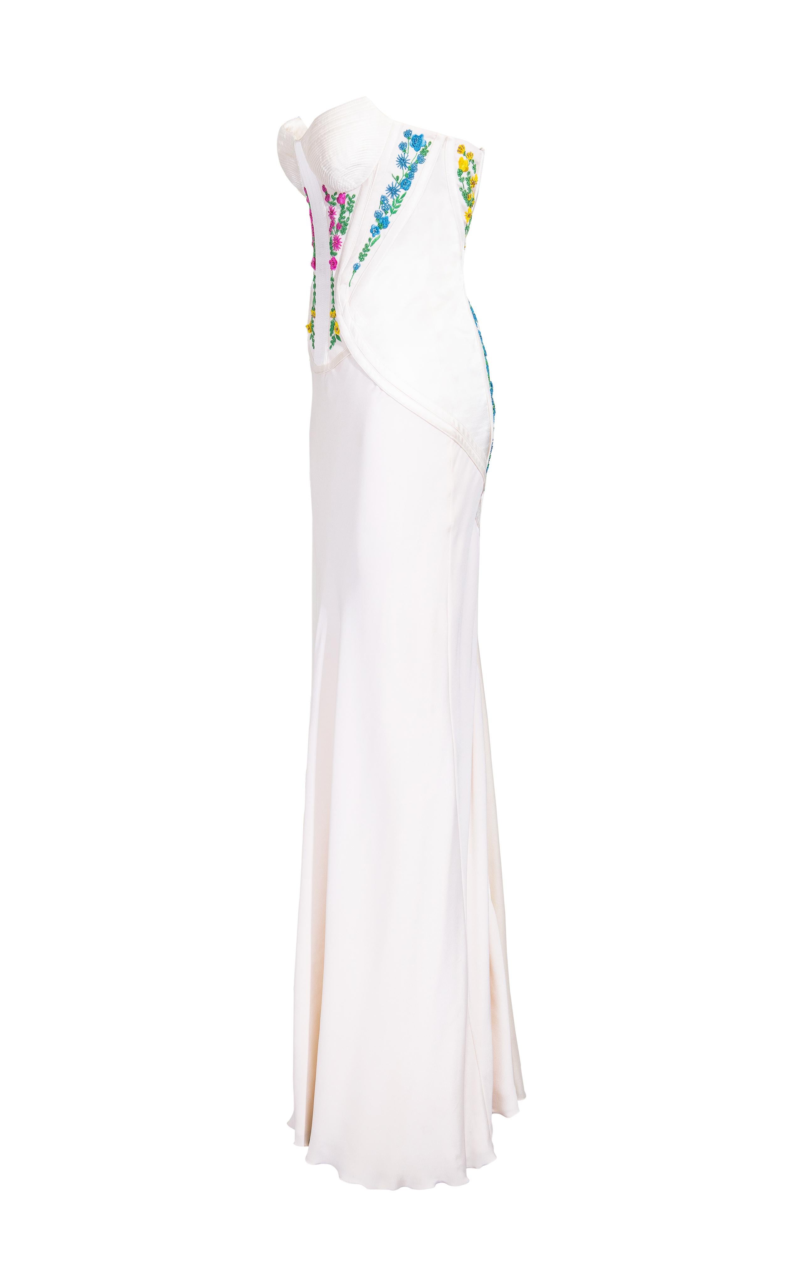 Atelier Versace white gown with colorful floral embroidery; a re-issue of S/S 1995 Gianni Versace design. Built-in corset with boning and curved paneling across hips creates beautiful shape across the body. New with original tags and original
