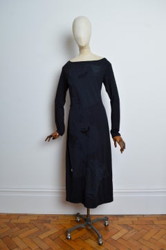 2000s Avant Guard Moschino Black long sleeve maxi dress with clothing appliqués