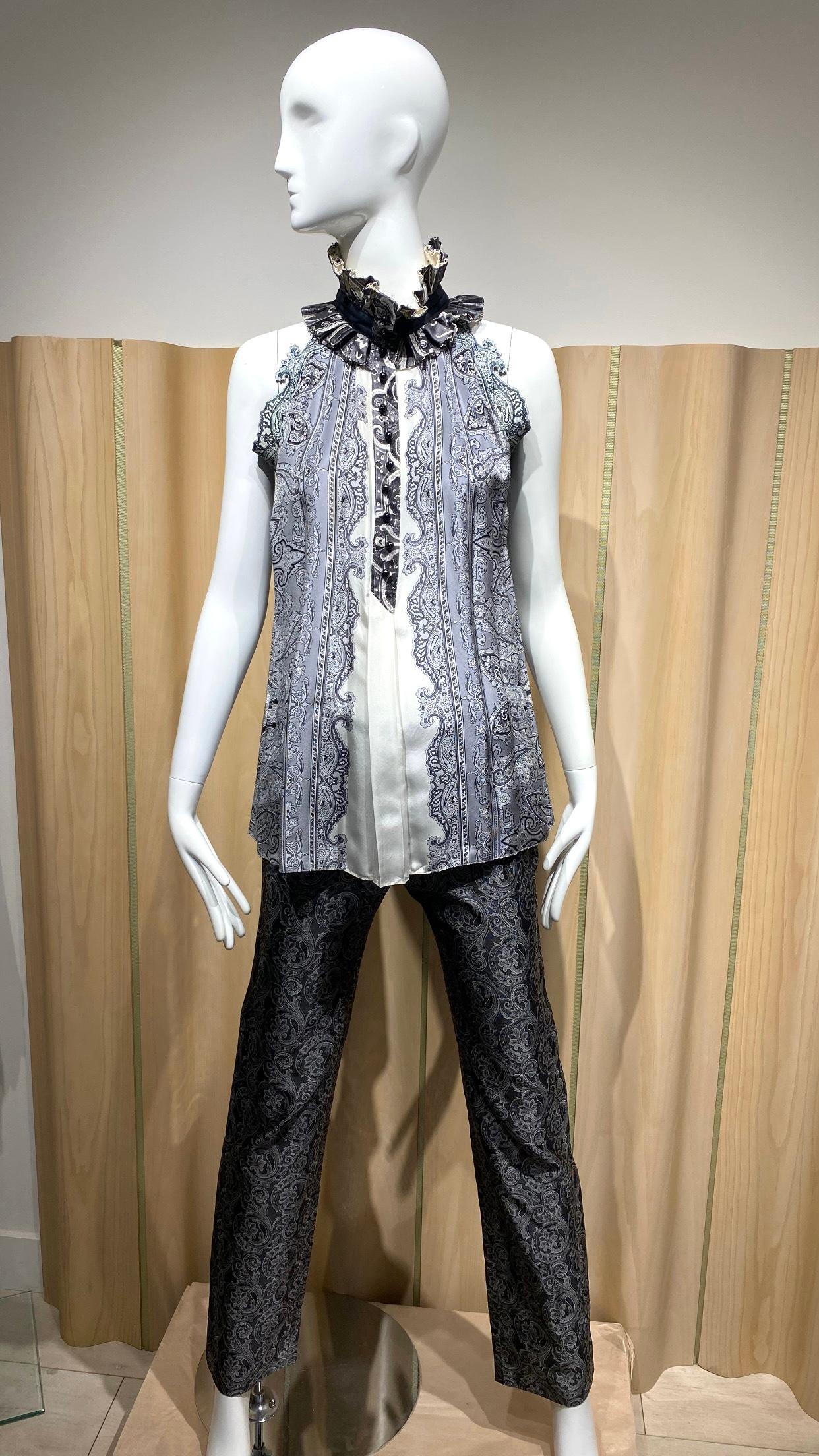 Spring/Summer 2006 Balenciaga Three piece suit
fitted Jacket, silk blouse and fitted pants designed by Nicolas Ghesquière. size 36fr
Beautiful  fitted jacket in grey, black and silver paisley print in silk twill jacquard. 
- Structured shoulder
- 