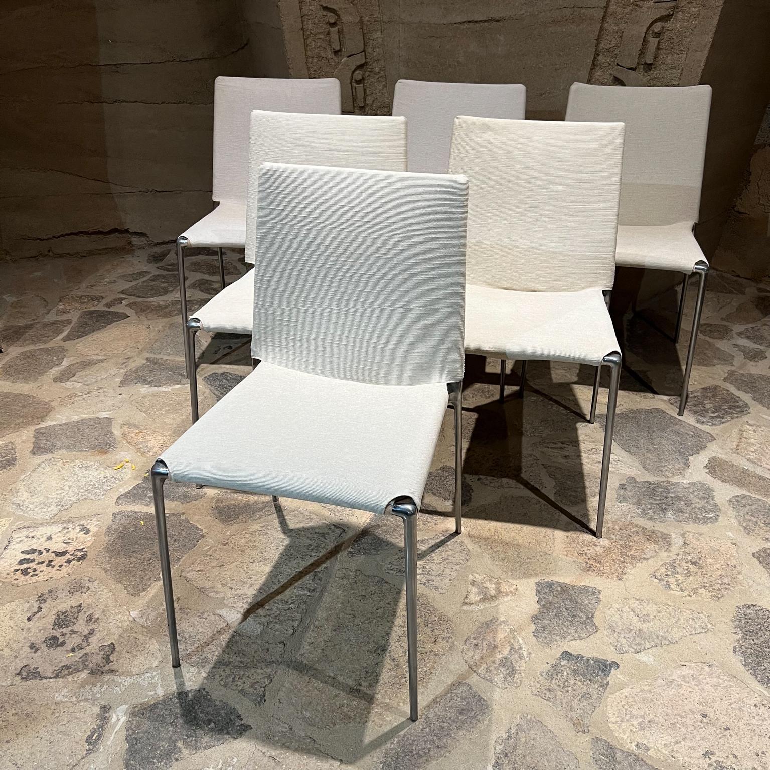 B&B Italia Set of 6 modern ALMA dining chairs White & Chrome 
designed by Roberto Barbieri for B&B Italia.
Stamped Italy. Fabulous feature of being stackable. Modern Flexibility.
32 H x 21D x 18W Seat 18.25H
Chairs retain original label. Built with