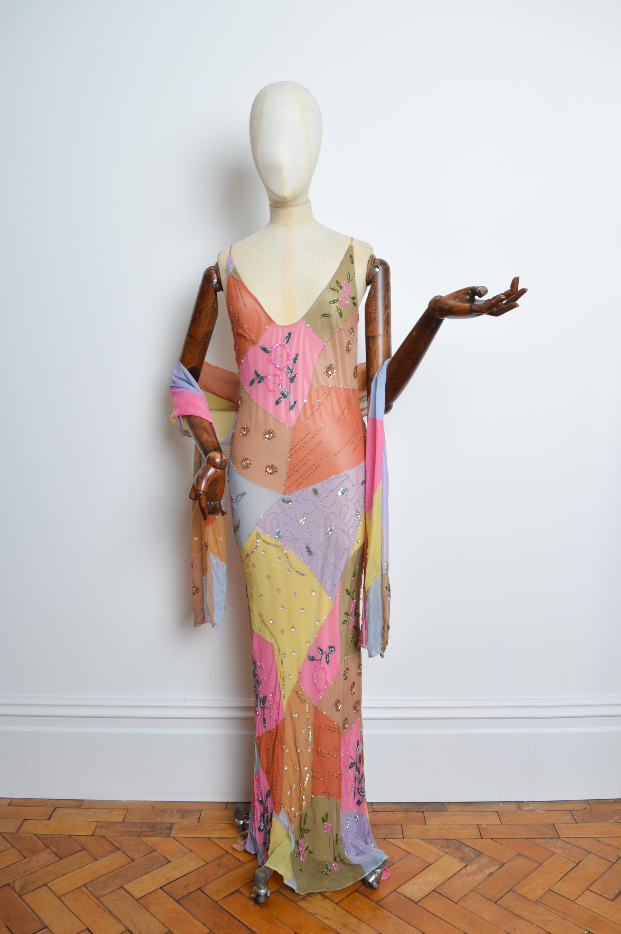 A 2000’s bias cut silk hand painted beaded embellished patchwork evening dress 
Size; UK 6 / XS
Measurements are provided in inches (‘’)
Pit to Pit; 16’’ - 17’’
Nape to Hem; 60’’
Waist; 26’’ 
Condition; 7/10. Overall great condition, despite minor