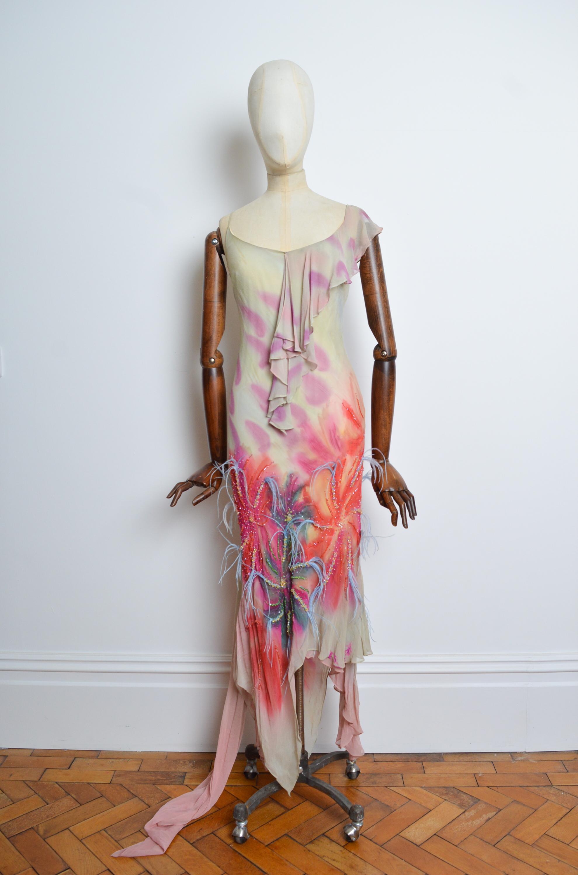A 2000’s bias cut silk hand painted Ostrich feather embellished ruffled evening dress by Jeff Gallano with shawl detail pinned to the strap. 
Size; UK 10 / Medium
Measurements are provided in inches (‘’)
Pit to Pit; 17’’ - 21’’
Nape to Hem; 47’’ -