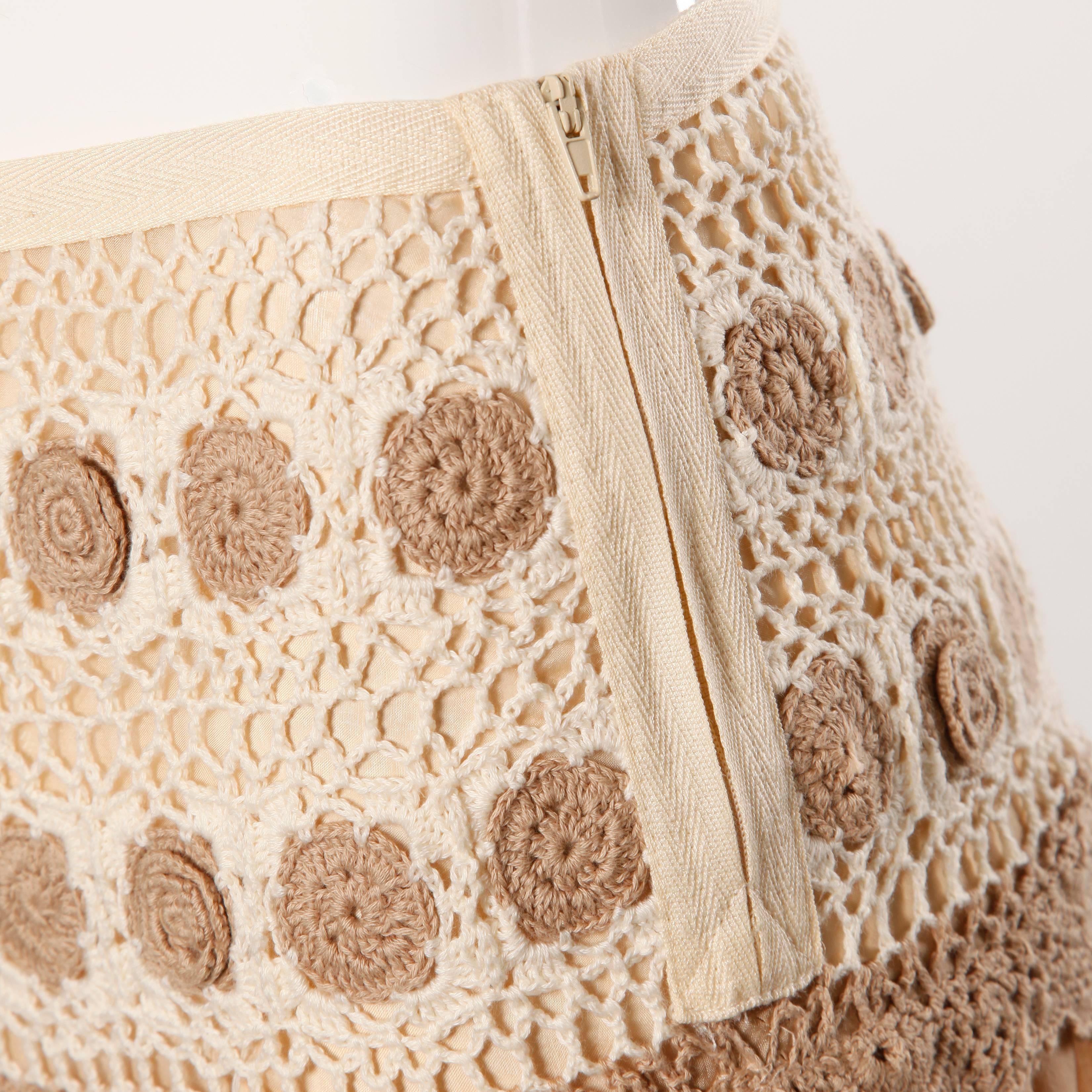 Delicate nude silk skirt with crochet detail by Blumarine. Pom pom trim and double side zippers.

Details: 

Fully Lined in Silk 
Side Zip on Both Sides
Marked Size: I 38/ D 32
Color: Beige
Fabric: Silk/ Crochet
Label: Blumarine

Measurements: