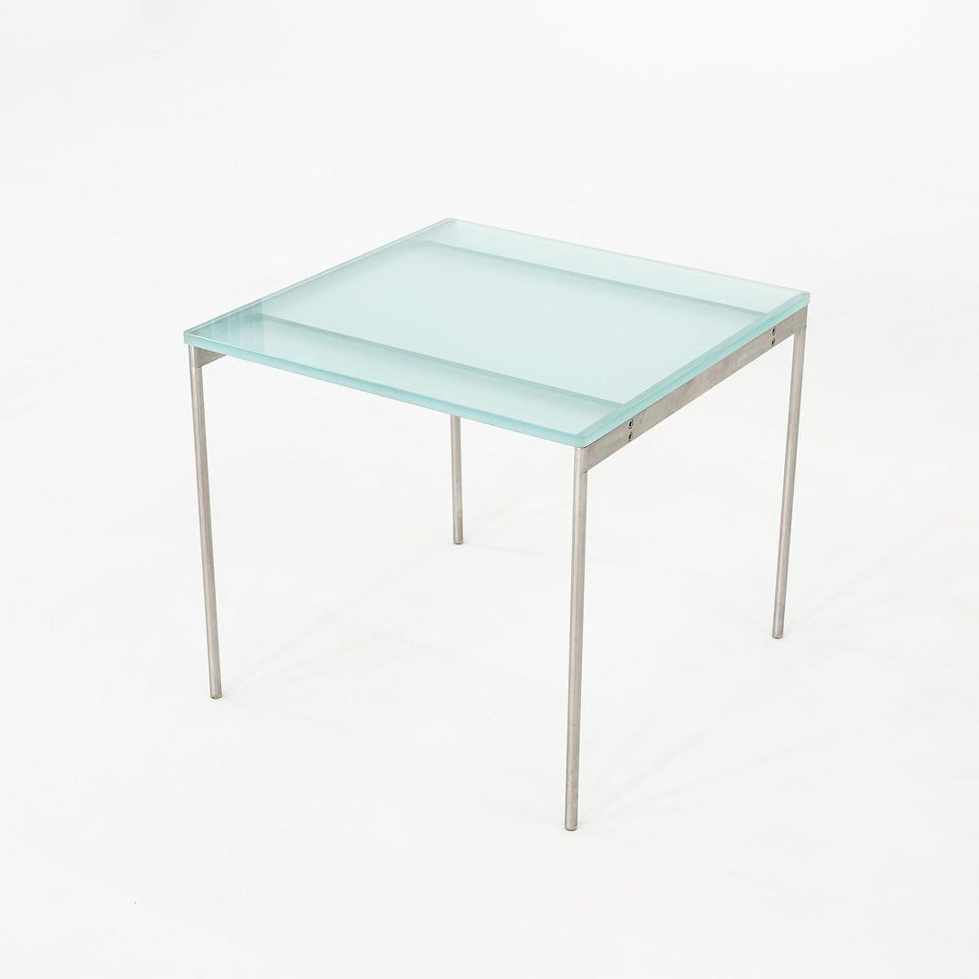 Il s'agit d'une table d'appoint ou de chevet carrée en verre sablé bleu clair et acier brossé, produite en Italie par Cappellini dans les années 2000. La structure de la table est composée d'acier inoxydable brossé et le plateau en verre sablé épais