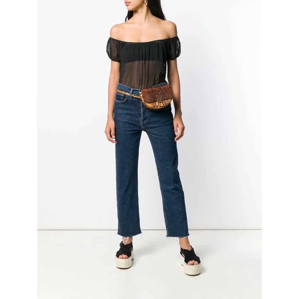 Chanel black mesh top. Stretch model, with bare shoulders, short puff sleeves and straight hem.

Size: 42 FR

Flat measurements
Height: 48 cm
Chest: 44 cm

Product code: A5991

Notes: Year: 2001

Composition: 75% Polyester - 25% Elastane

Made in: