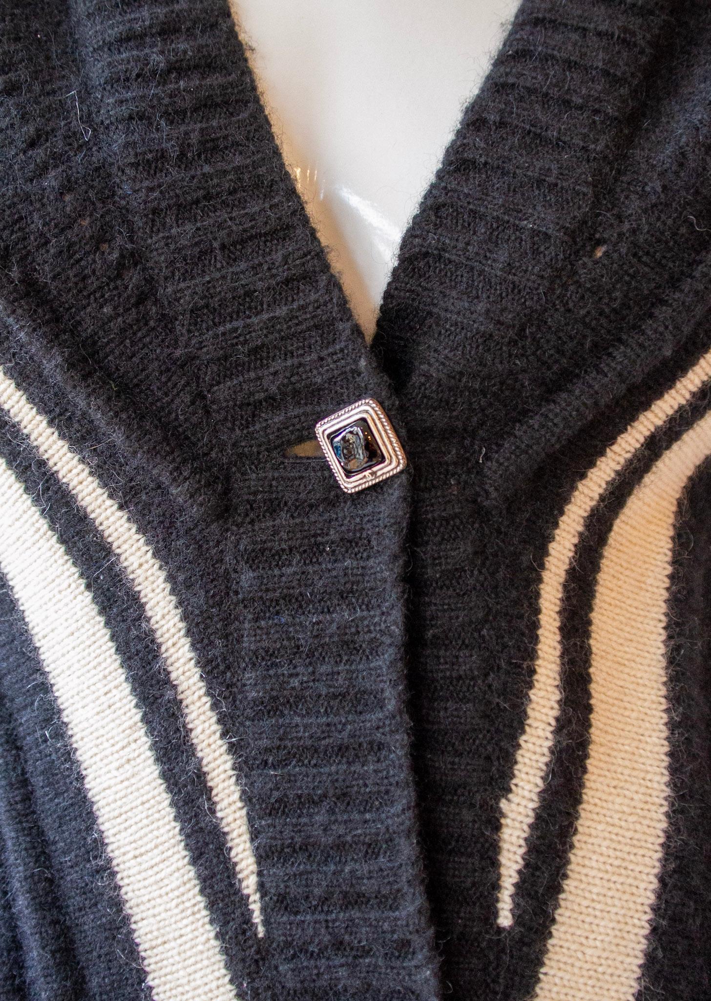 Chanel, black and white cashmere and mohair knee length short-sleeve cardigan with Chanel logo square buttons, deep v-neckline 

Sz 38