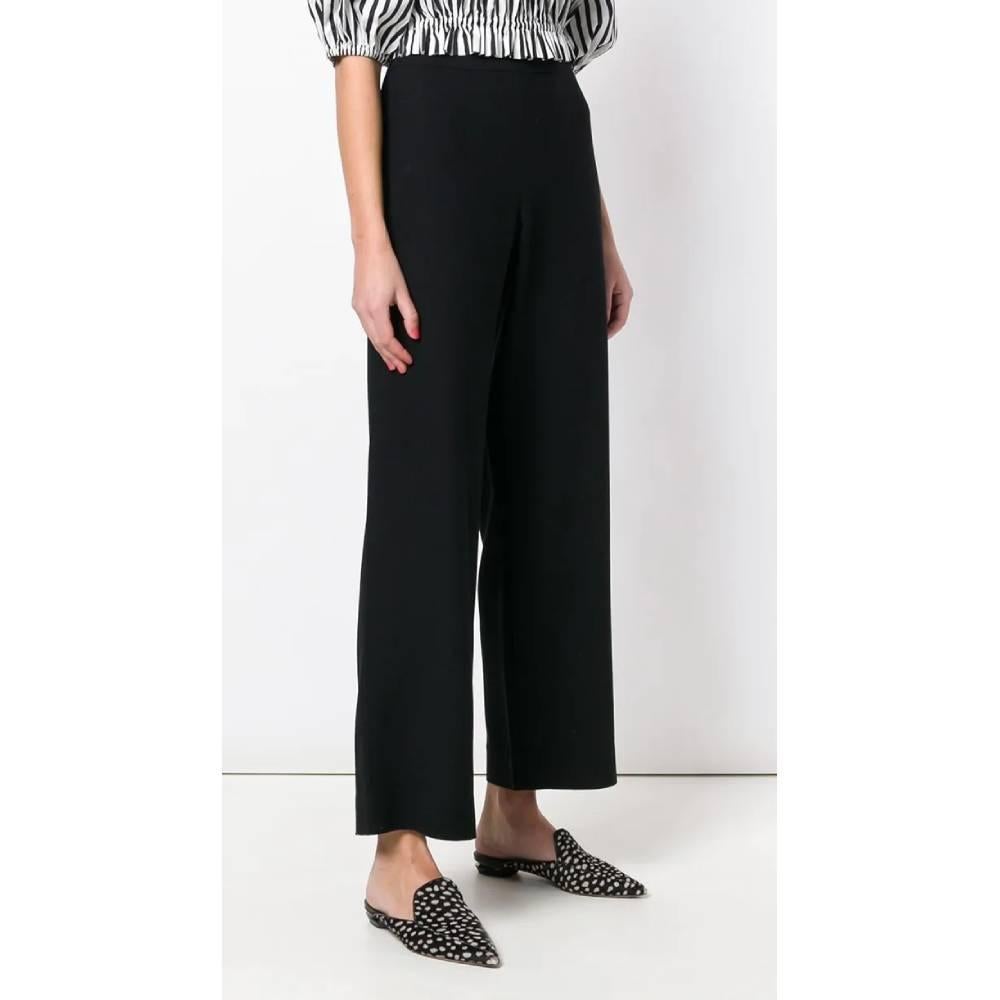 Chanel wide black wool trousers, high waist and side closure with invisible zip and button.
Years: 2000s

Made in France

Size: 42 FR

Linear measures

Waist: 40 cm
Hips: 58 cm
Inside Leg: 80 cm