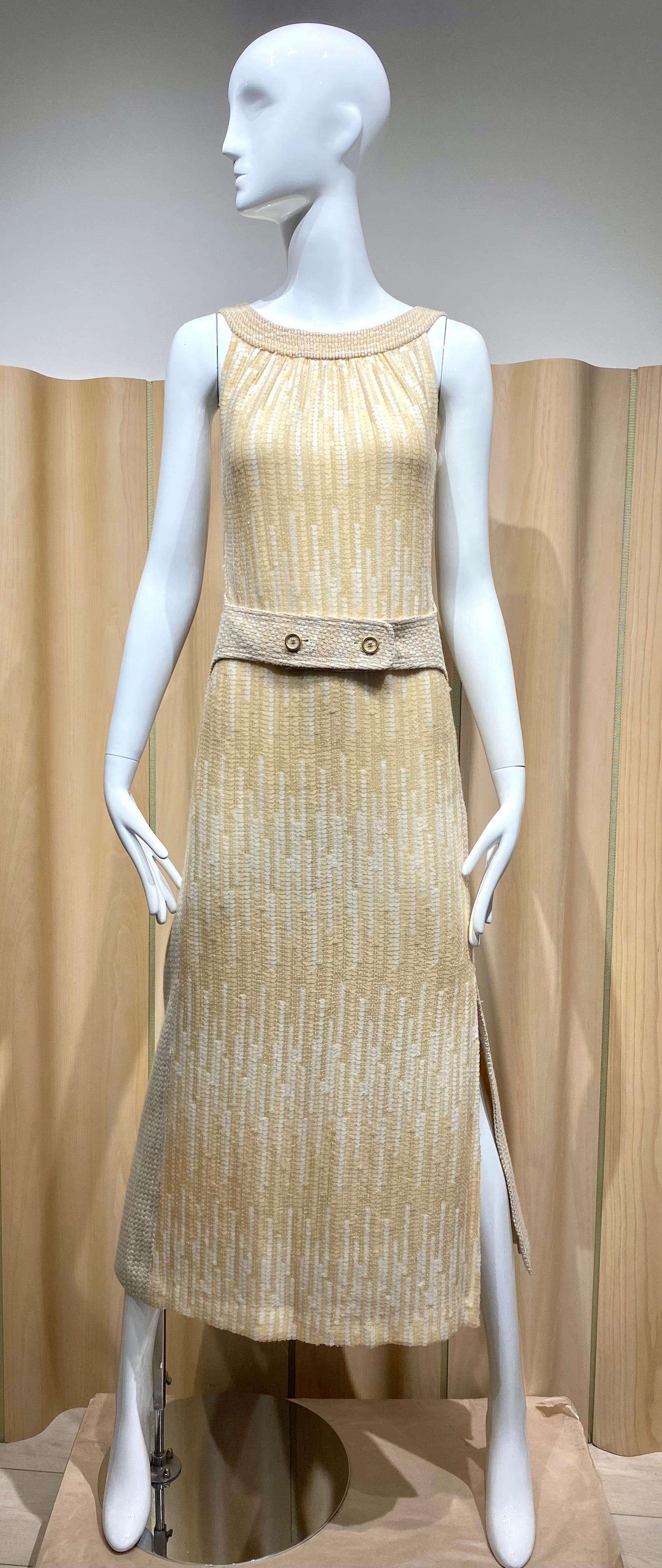 2001 Chanel cream tweed sleeveless evening dress with sequins and gathered scoop neckline.
interlocking cc belt at waist.
Duster tweed coat with high slit back.
Marked size 40
Fit size 4/6