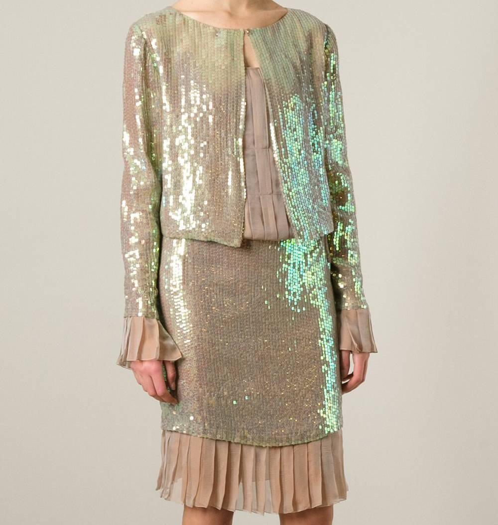 Marvellous Chanel pink silk blend dress and sequins jacket suit. It features a jacket with a collarless design, sequin embroidery, an open front, a front hook and eye fastening, ruffled sleeves and a cropped length. The dress features spaghetti