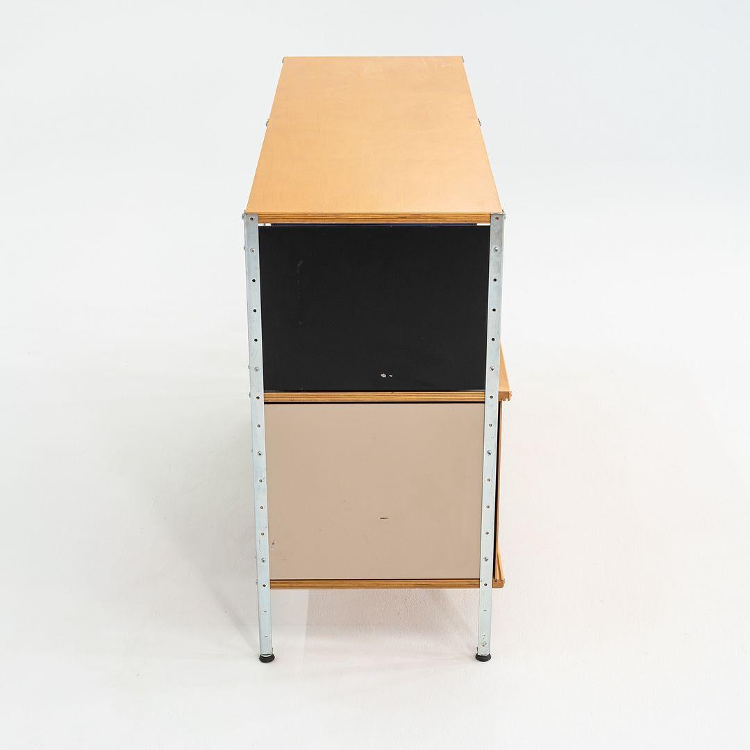 This is an ESU 230-C with doors designed by Ray and Charles Eames for Herman Miller in 1950. This particular example was produced in the 2000s. This line was discontinued in 1955, and was re-released in 1998 after a 43 year break. The frame is