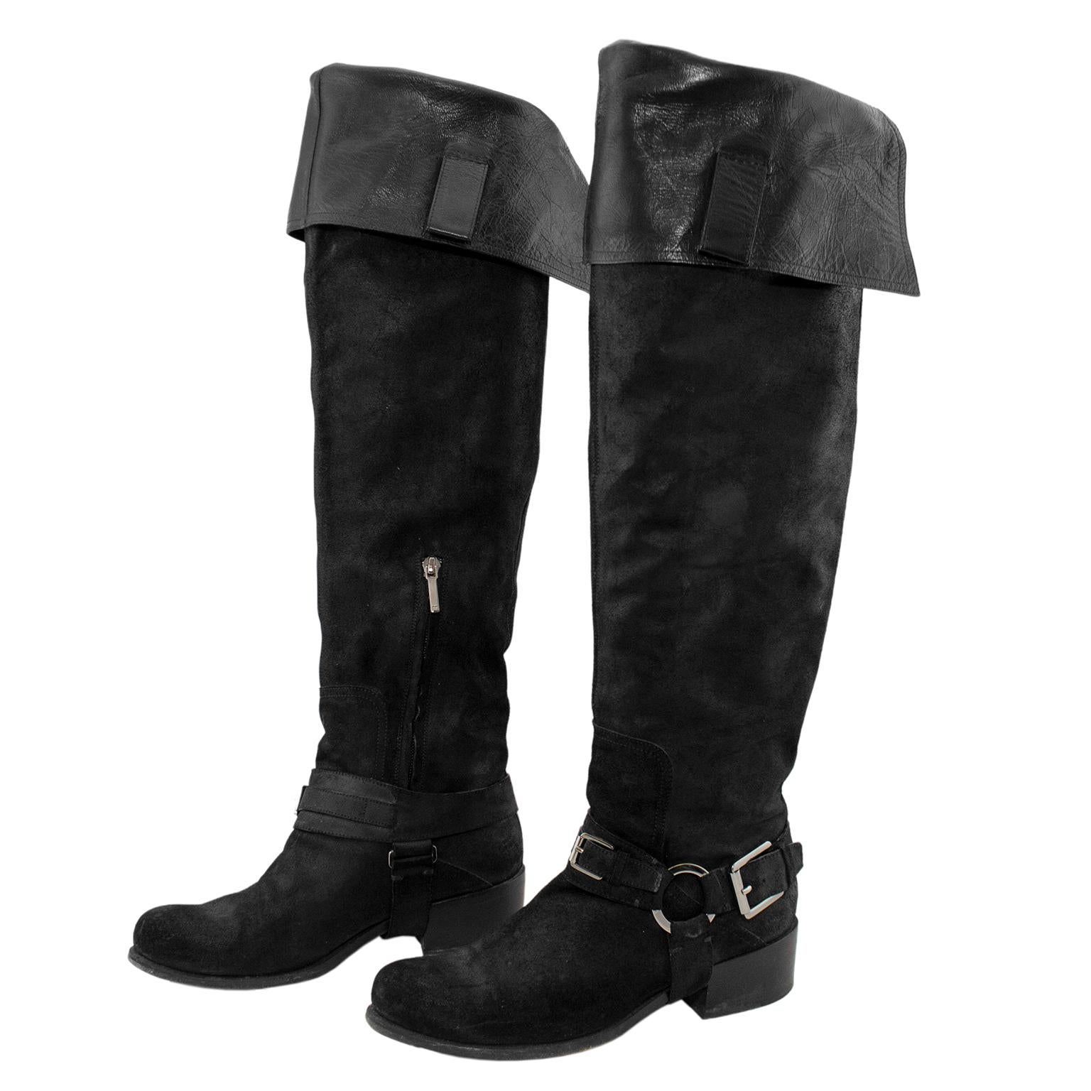 Chic black suede Dior over-the-knee buccaneer boots in excellent condition. Block heel on a heavy sole, wrap around straps and concealed inside zip closure, silver metal tone buckle and circular CD branded link. Heel 1.5