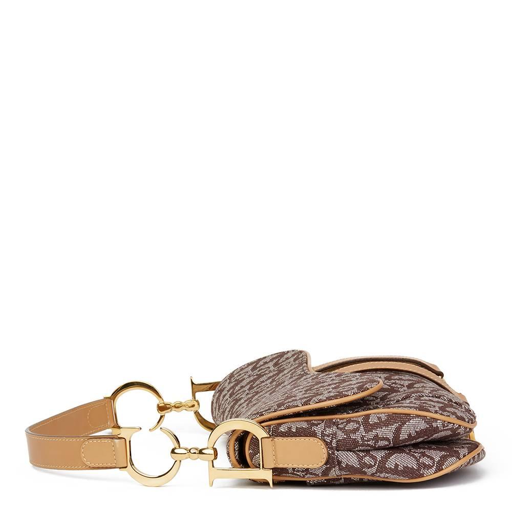 Christian Dior Brown Monogram Canvas Saddle Bag

This Christian Dior Saddle Bag is in Excellent Pre-Owned Condition accompanied by Christian Dior Dust Bag. Circa 2001. Primarily made from Canvas, Calfskin Leather complimented by Gold hardware. Our 