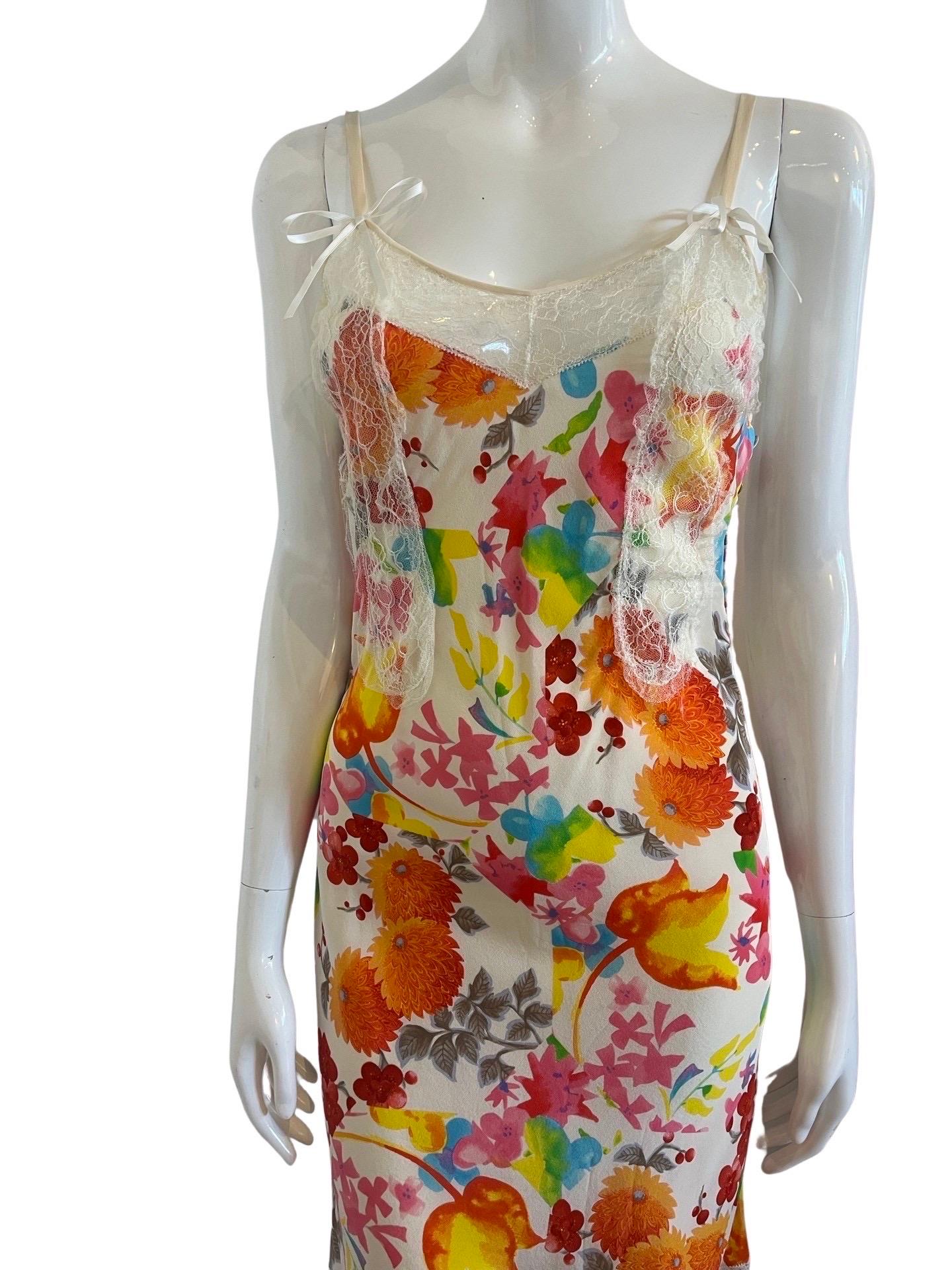 Stunning Christian Dior by John Galliano dress from an early 00's collection.  This is a mid-length slip dress done in silk with lace detailing in silk printed acid bright color chrysanthemum and floral print.  In classic Galliano design, this dress