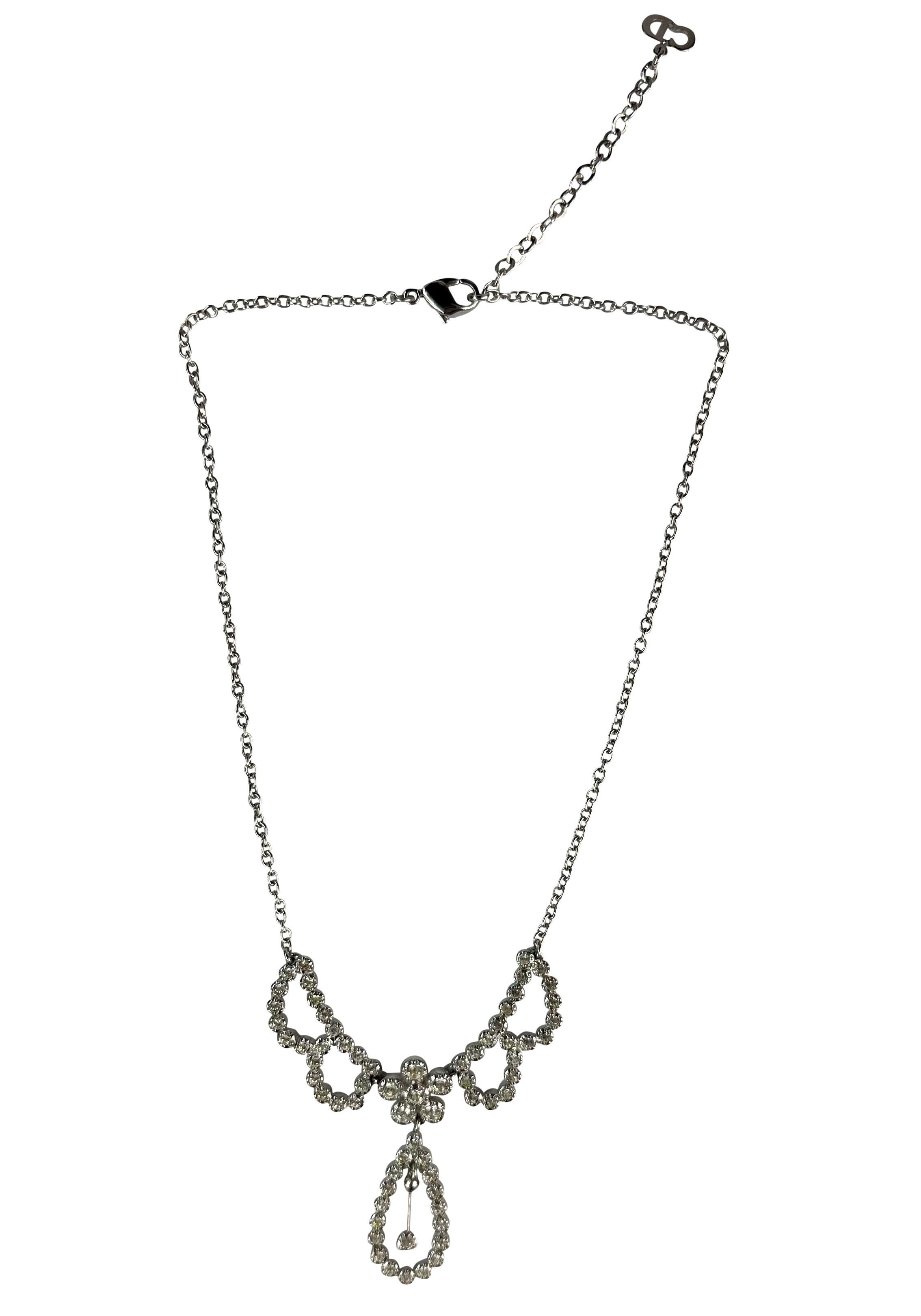 Presenting a silver-tone Christian Dior rhinestone accented drop necklace, designed by John Galliano. From the early 2000s, this beautiful necklace features a dainty chain with a rhinestone-covered drop.

Approximate Measurements:
Chain Length: 15 -