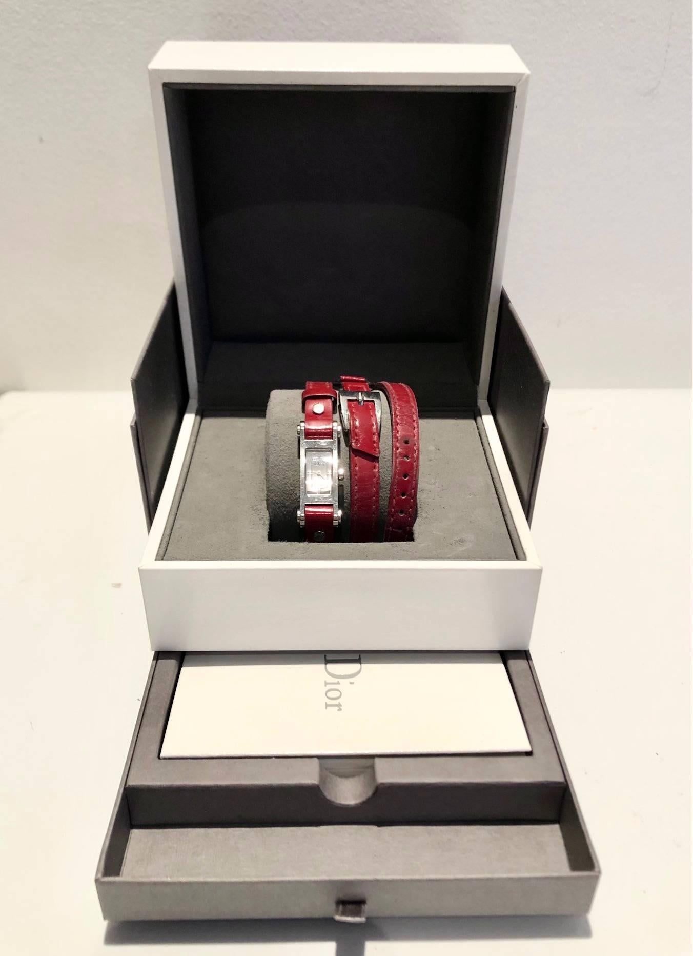 FREE UK and WORLDWIDE DELIVERY 

Christian Dior 'Dior 66' model watch, fine red leather double tour strap, slim rectangular shape with a silver face in a polished steel case, featuring the simple ‘Dior’ logo in black. 

Condition: 2005, vintage,